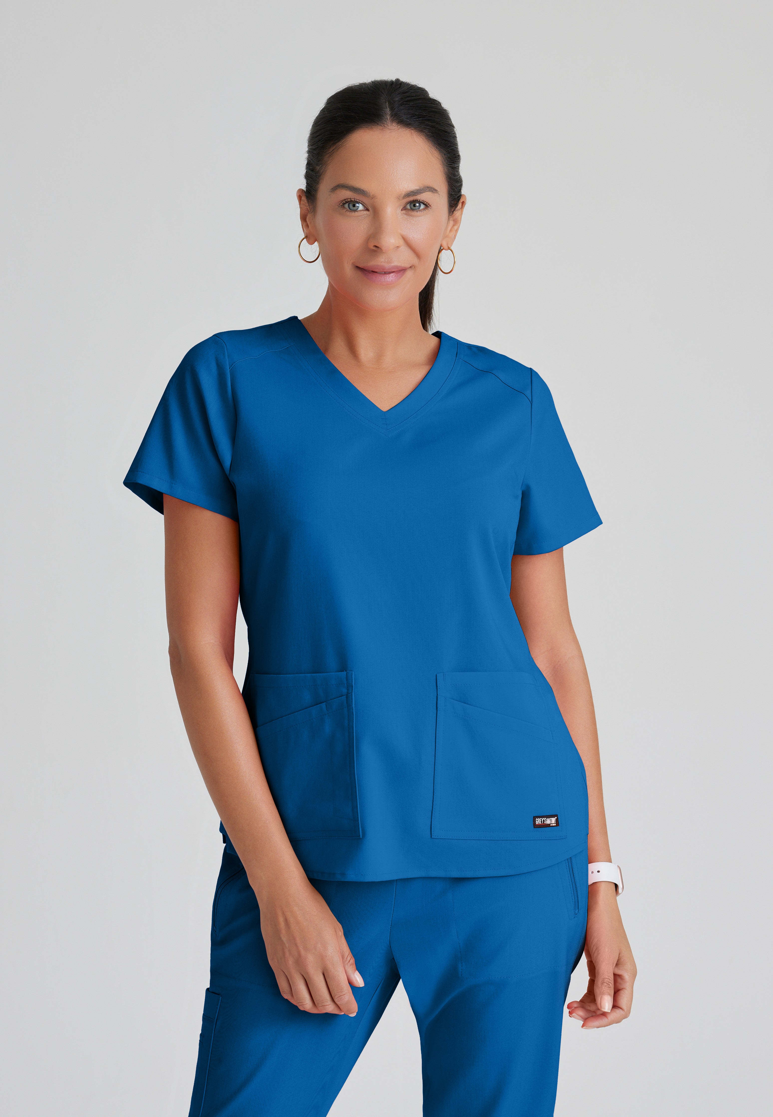 Front View of the Emma 4-Pocket V-Neck Scrub Top in New Royal from Grey's Anatomy™ by Barco Spandex Stretch