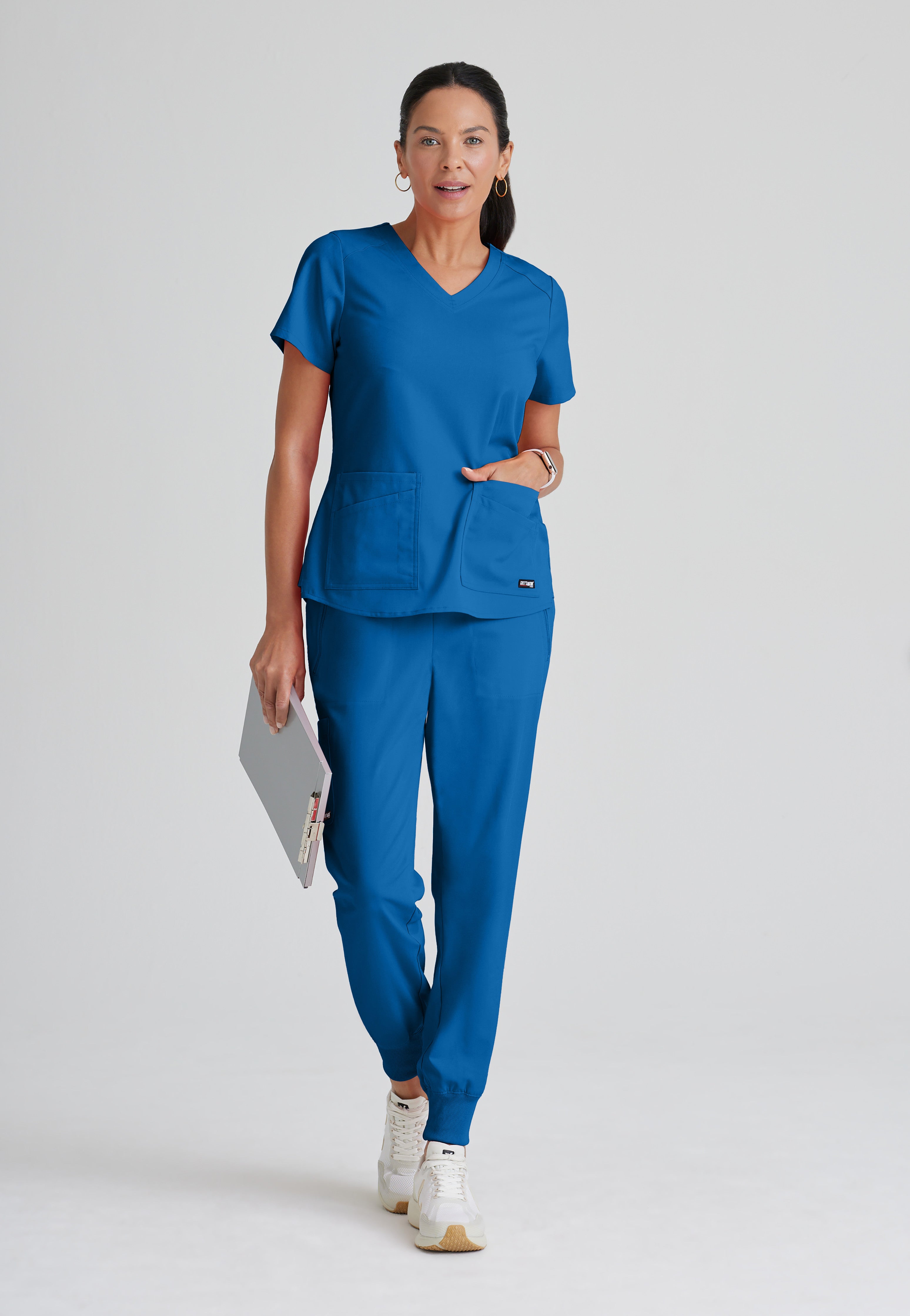 Full Body View of the Emma 4-Pocket V-Neck Scrub Top in New Royal from Grey's Anatomy™ by Barco Spandex Stretch