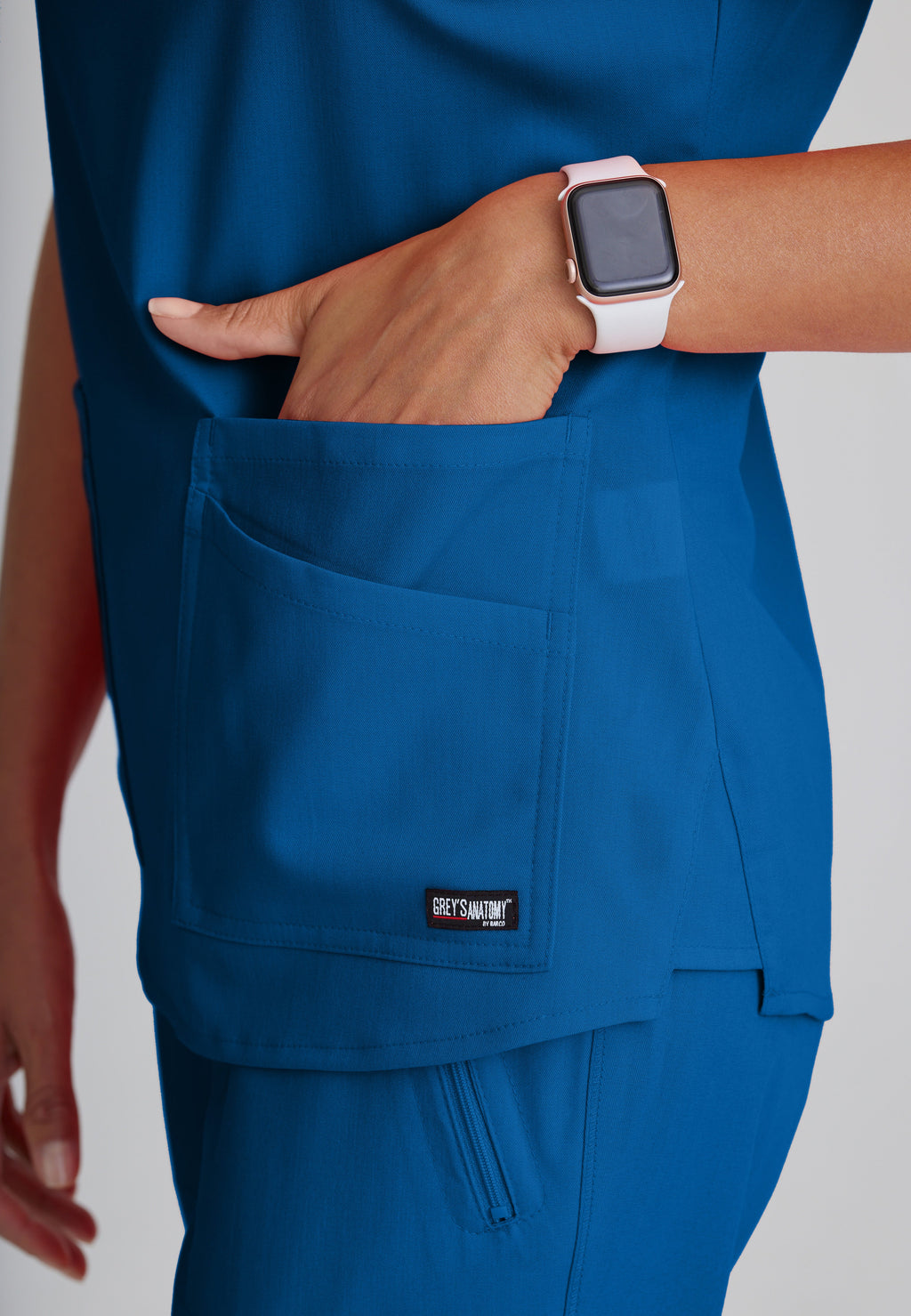 Detail Shot of the Emma 4-Pocket V-Neck Scrub Top in New Royal from Grey's Anatomy™ by Barco Spandex Stretch