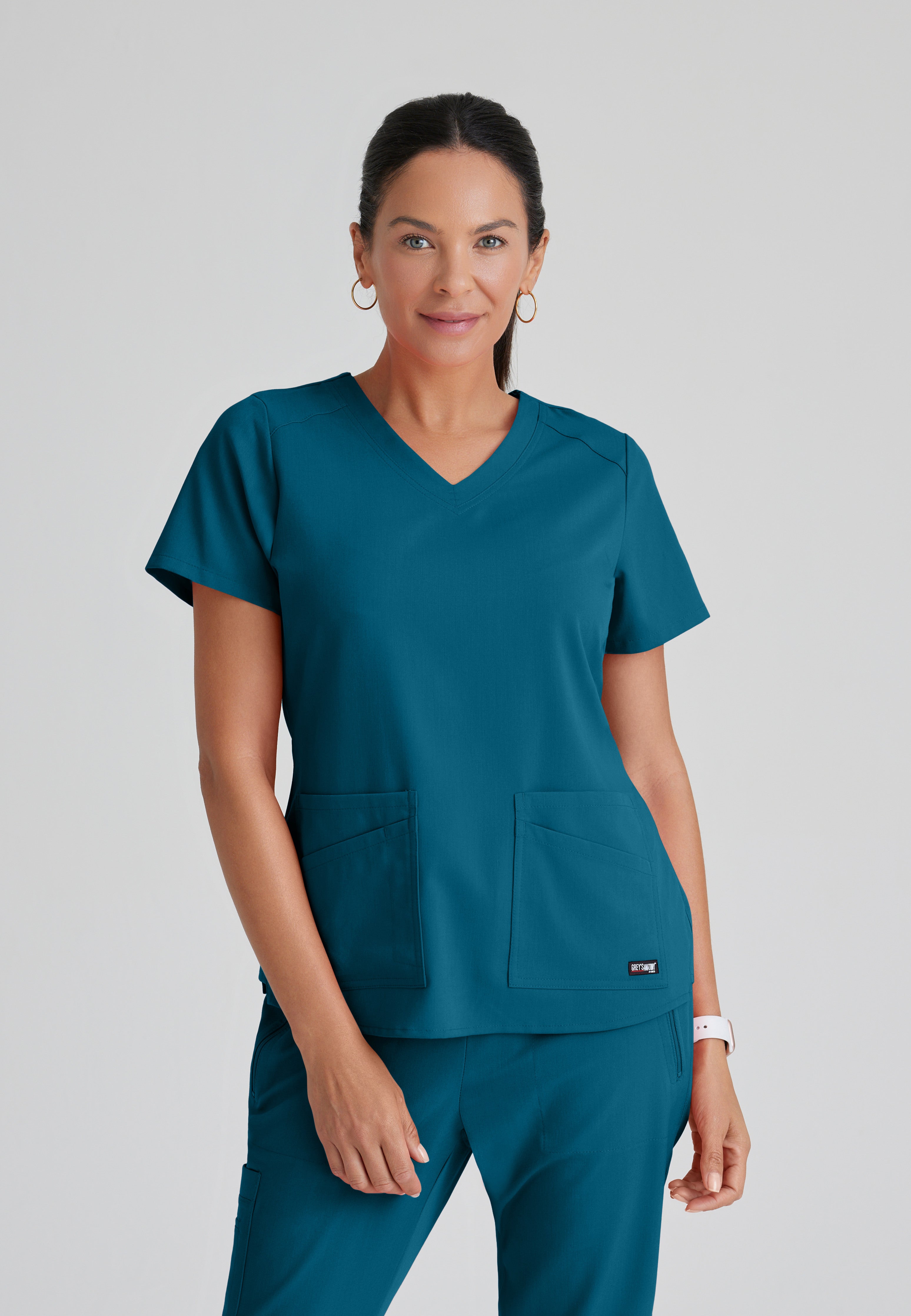 Front View of the Emma 4-Pocket V-Neck Scrub Top in Bahama from Grey's Anatomy™ by Barco Spandex Stretch