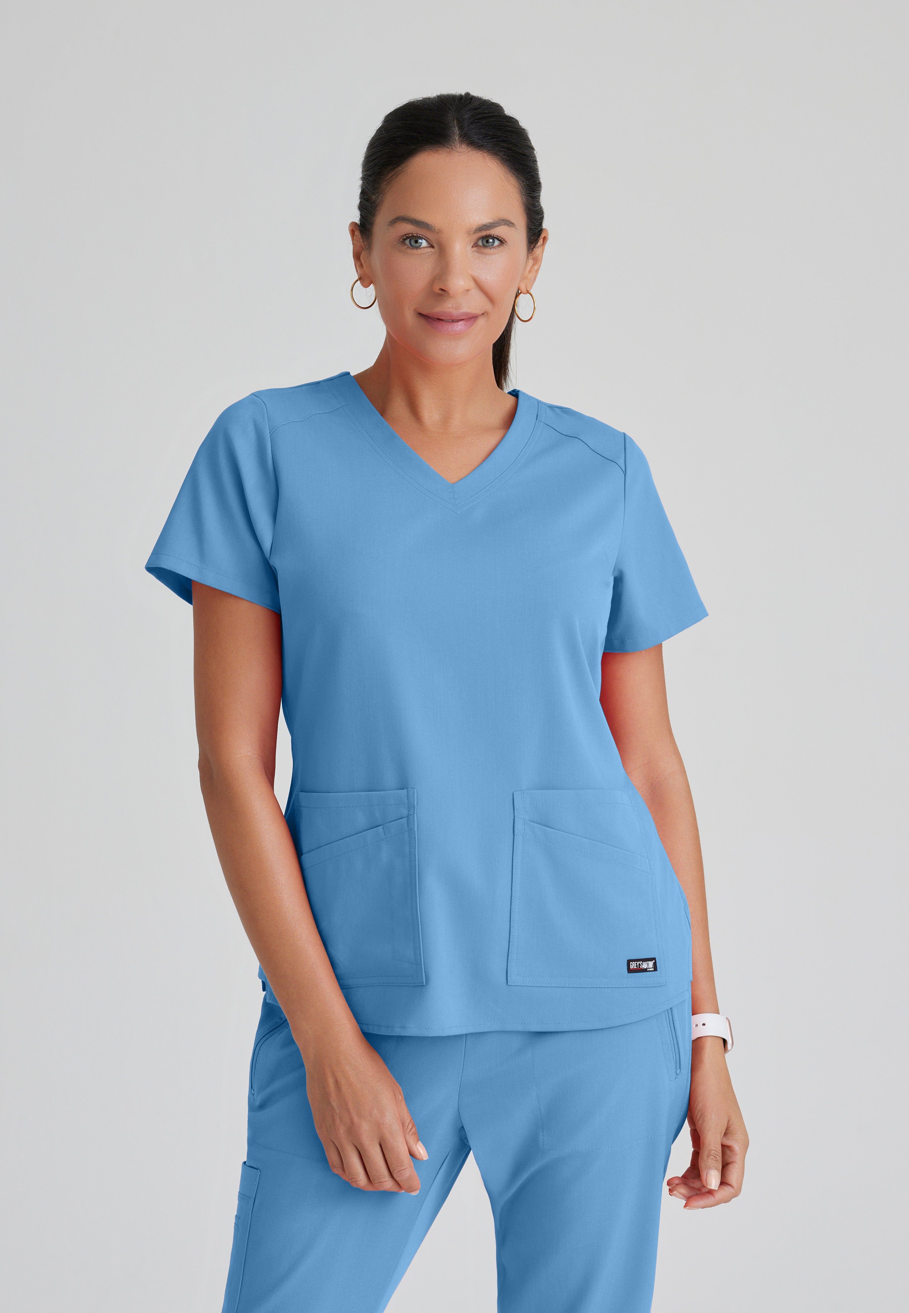 Front View of the Emma 4-Pocket V-Neck Scrub Top in Ciel Blue from Grey's Anatomy™ by Barco Spandex Stretch