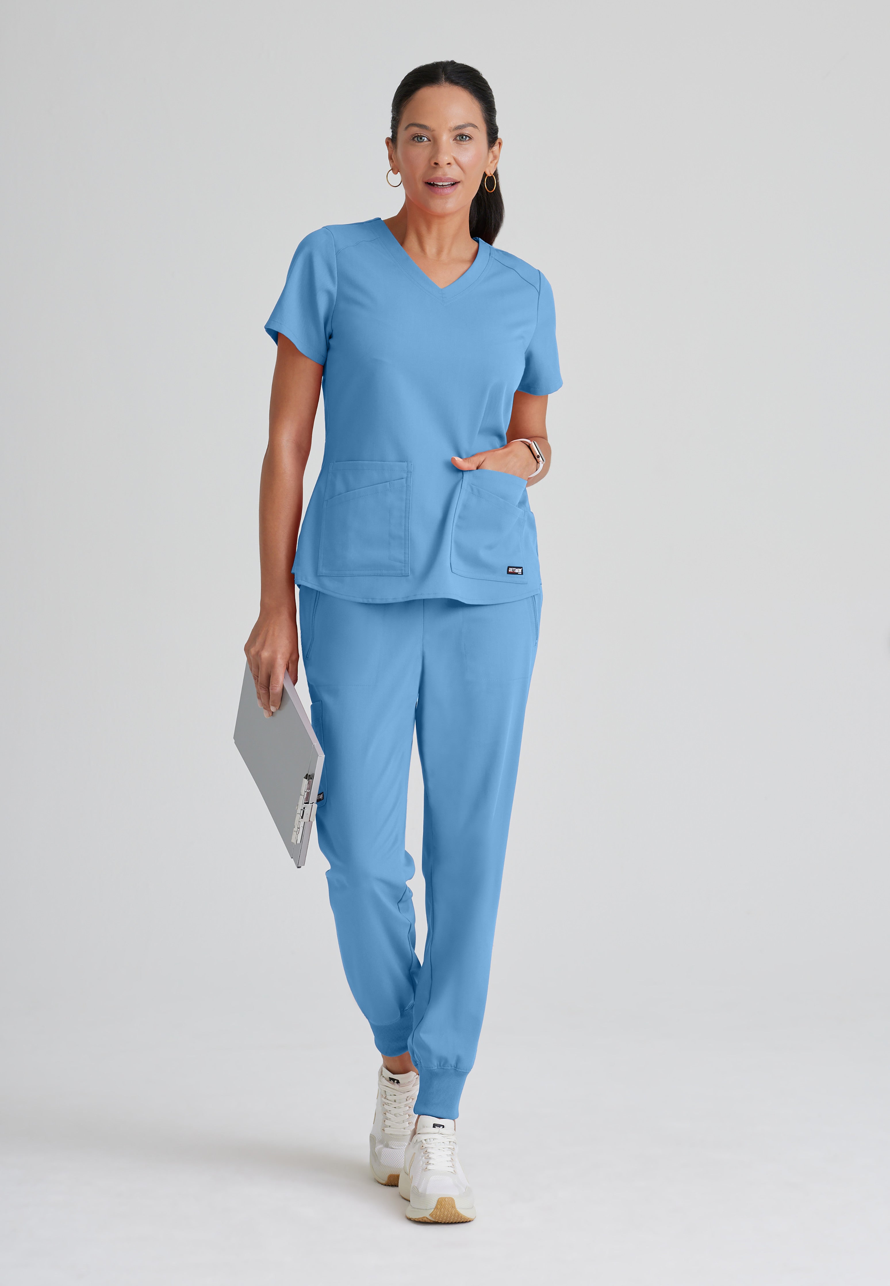Full Body View of the Emma 4-Pocket V-Neck Scrub Top in Ciel Blue from Grey's Anatomy™ by Barco Spandex Stretch