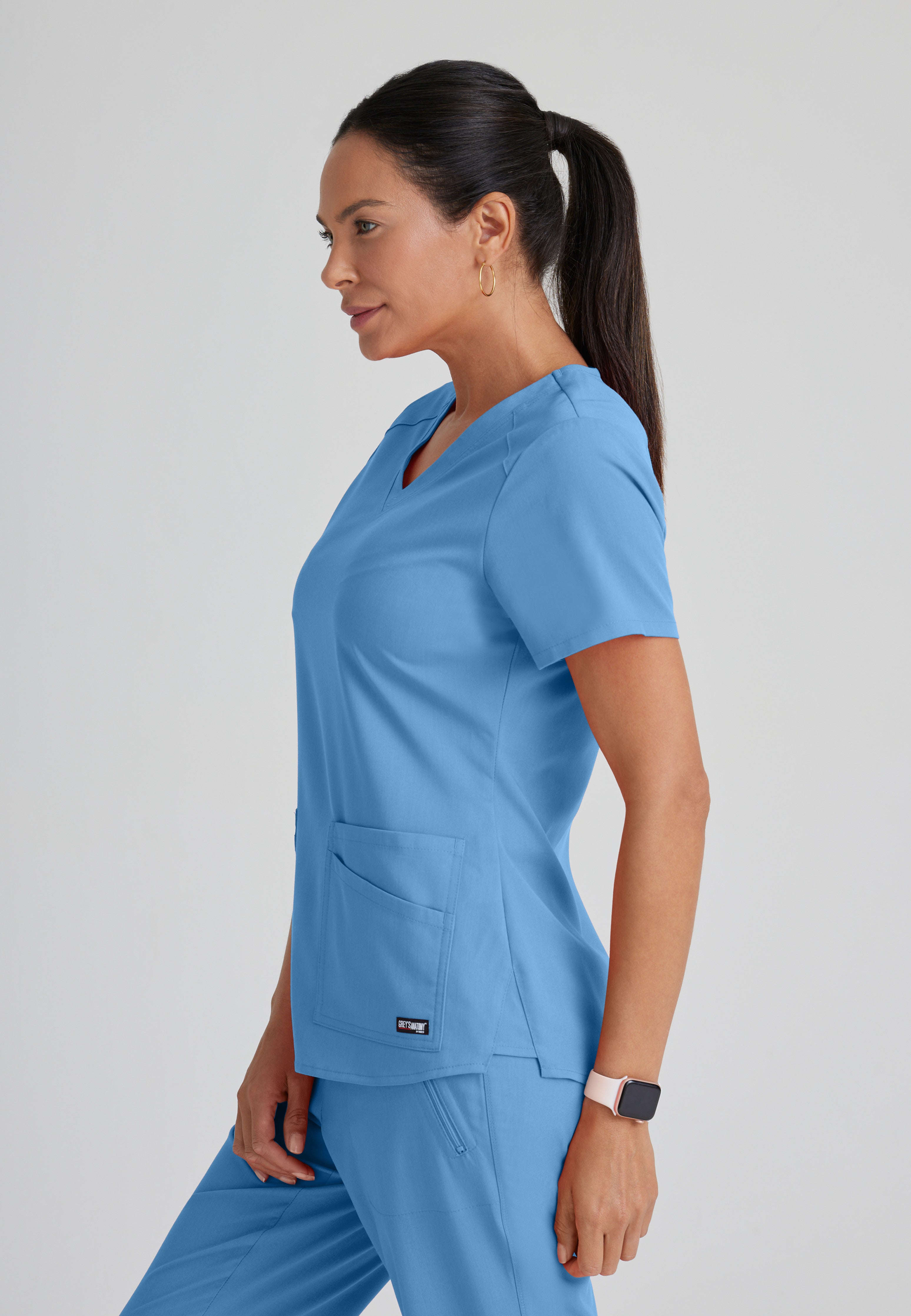 Side View of the Emma 4-Pocket V-Neck Scrub Top in Ciel Blue from Grey's Anatomy™ by Barco Spandex Stretch