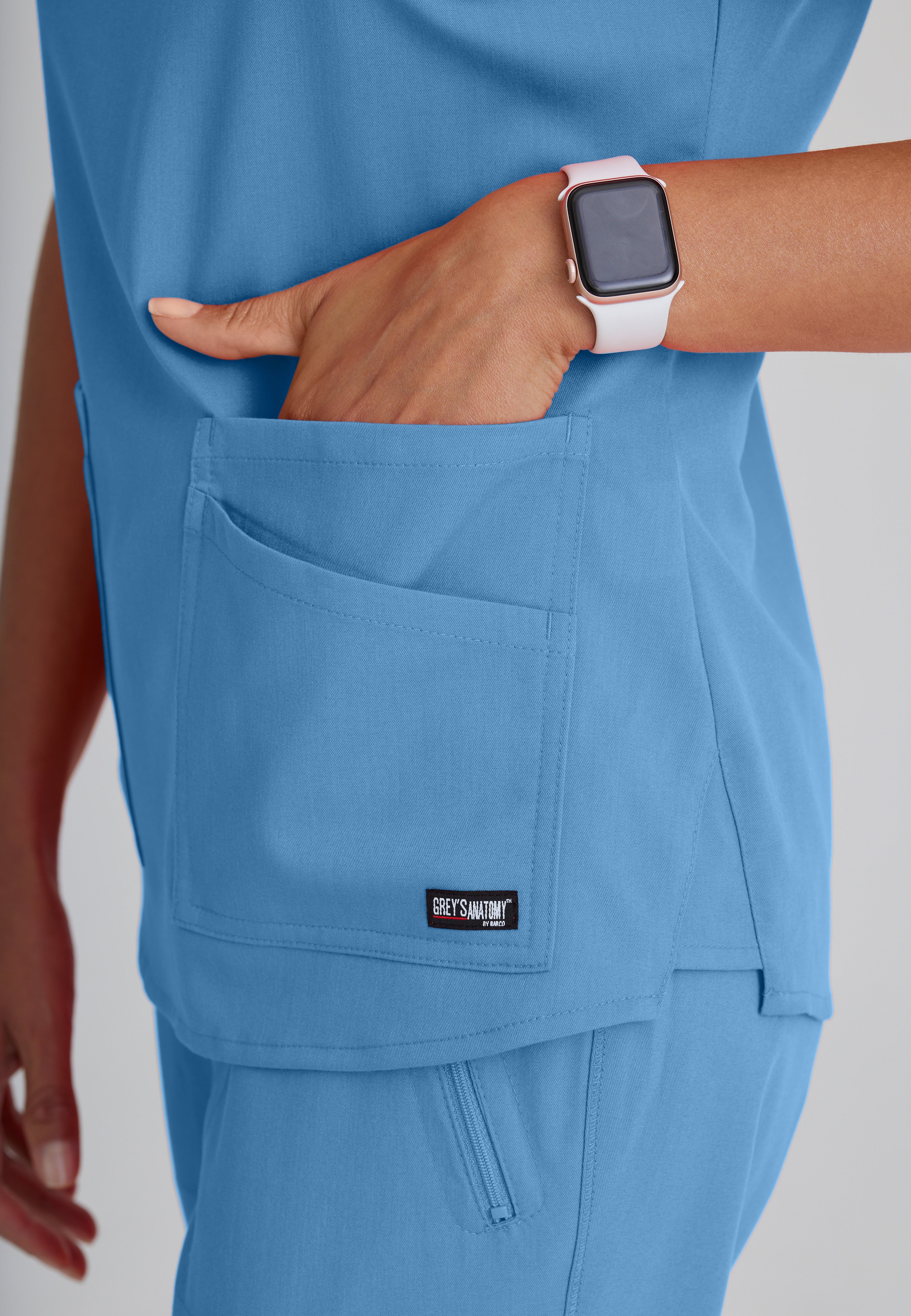 Detail Shot of the Emma 4-Pocket V-Neck Scrub Top in Ciel Blue from Grey's Anatomy™ by Barco Spandex Stretch