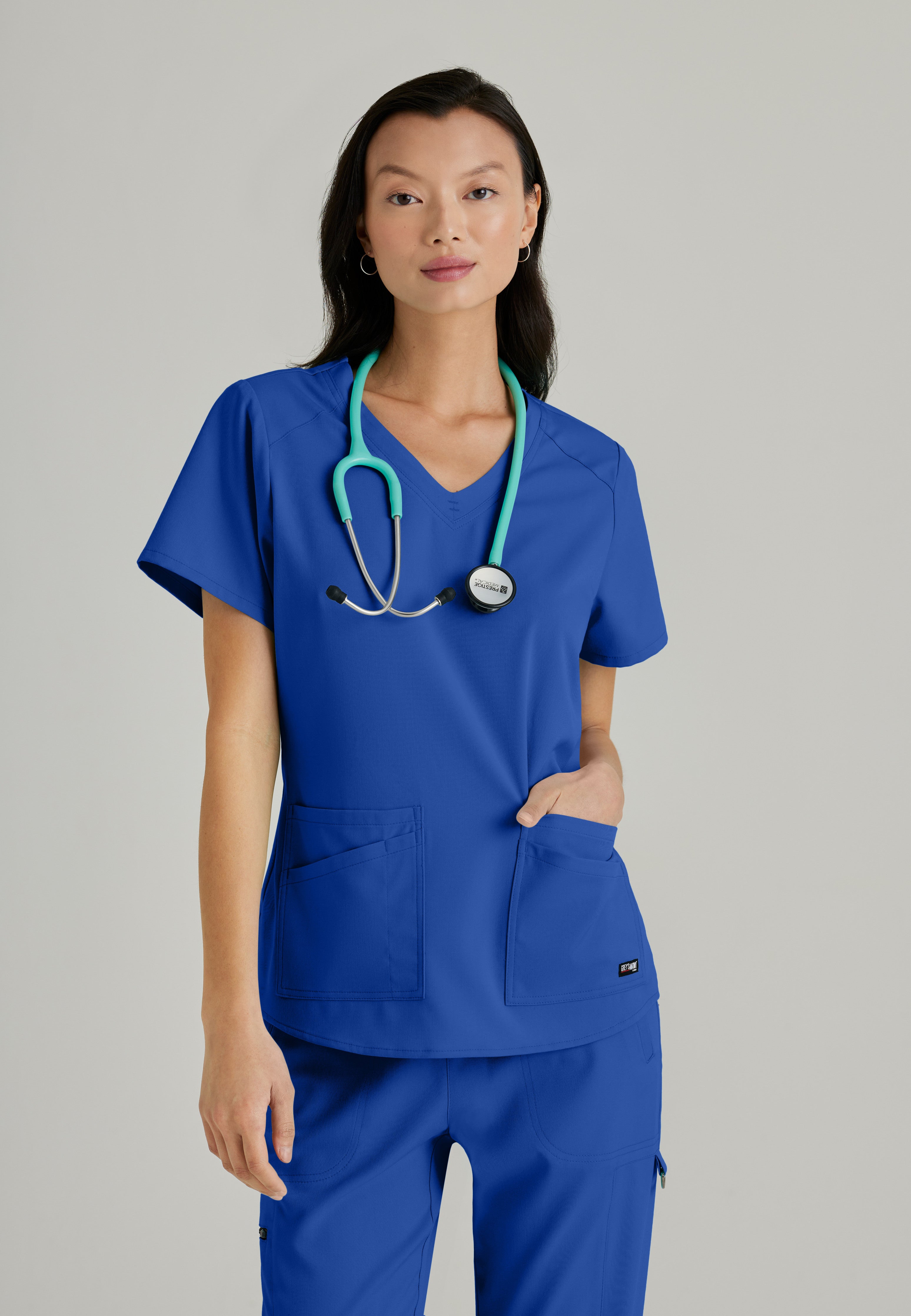 Front View of the Emma 4-Pocket V-Neck Scrub Top in Galaxy from Grey's Anatomy™ by Barco Spandex Stretch