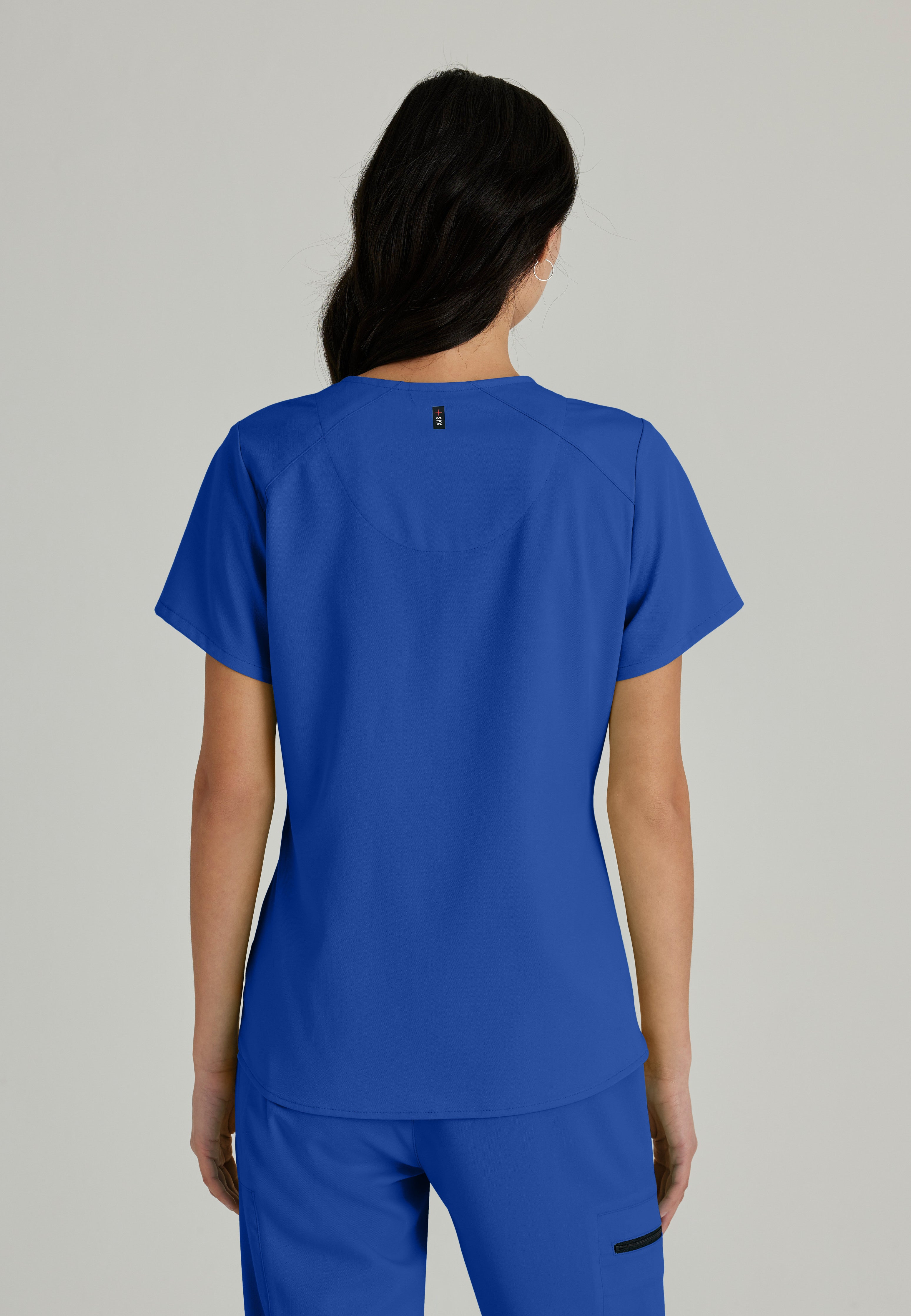 Side View of the Emma 4-Pocket V-Neck Scrub Top in Galaxy from Grey's Anatomy™ by Barco Spandex Stretch