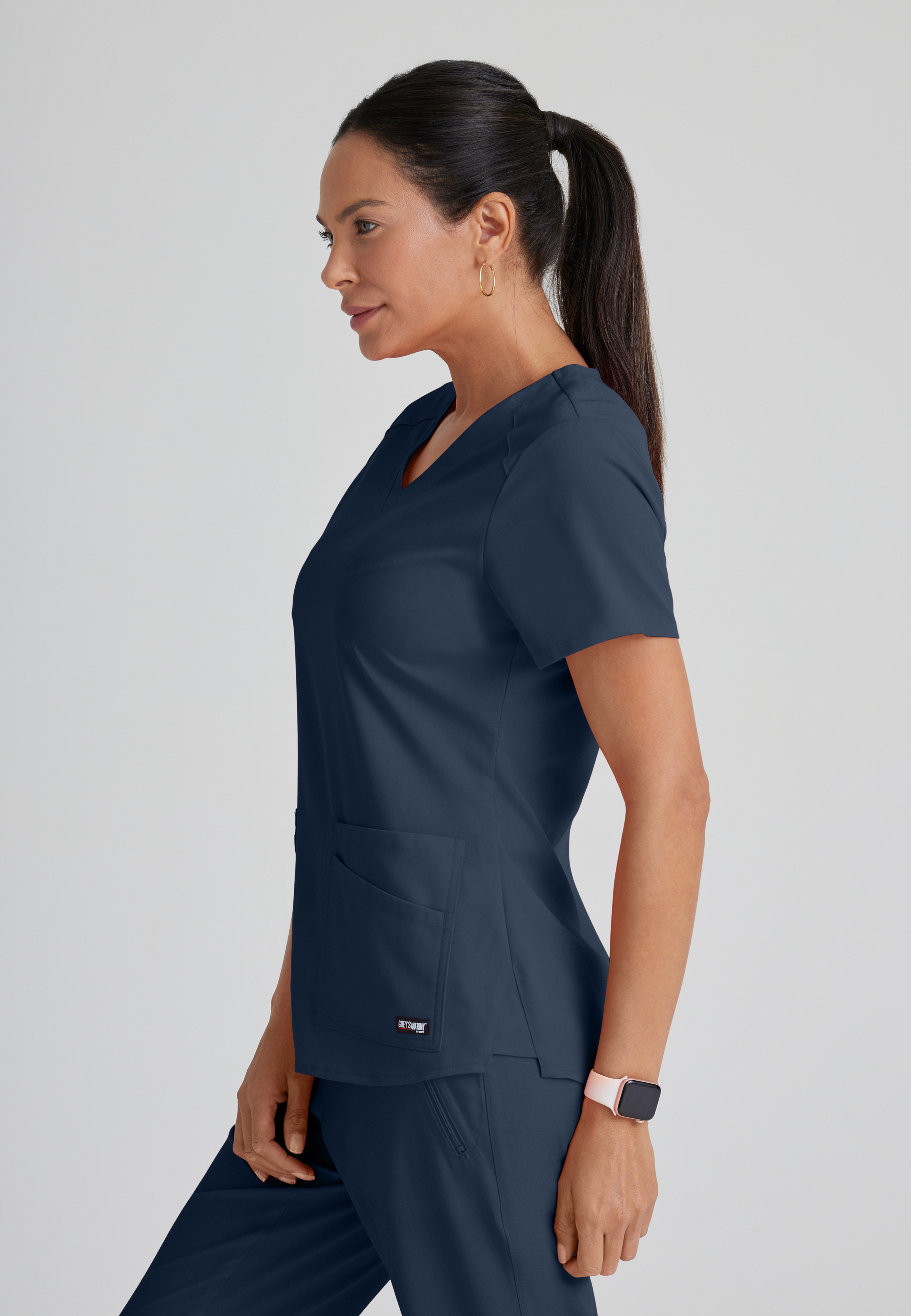 Side View of the Emma 4-Pocket V-Neck Scrub Top in Steel from Grey's Anatomy™ by Barco Spandex Stretch