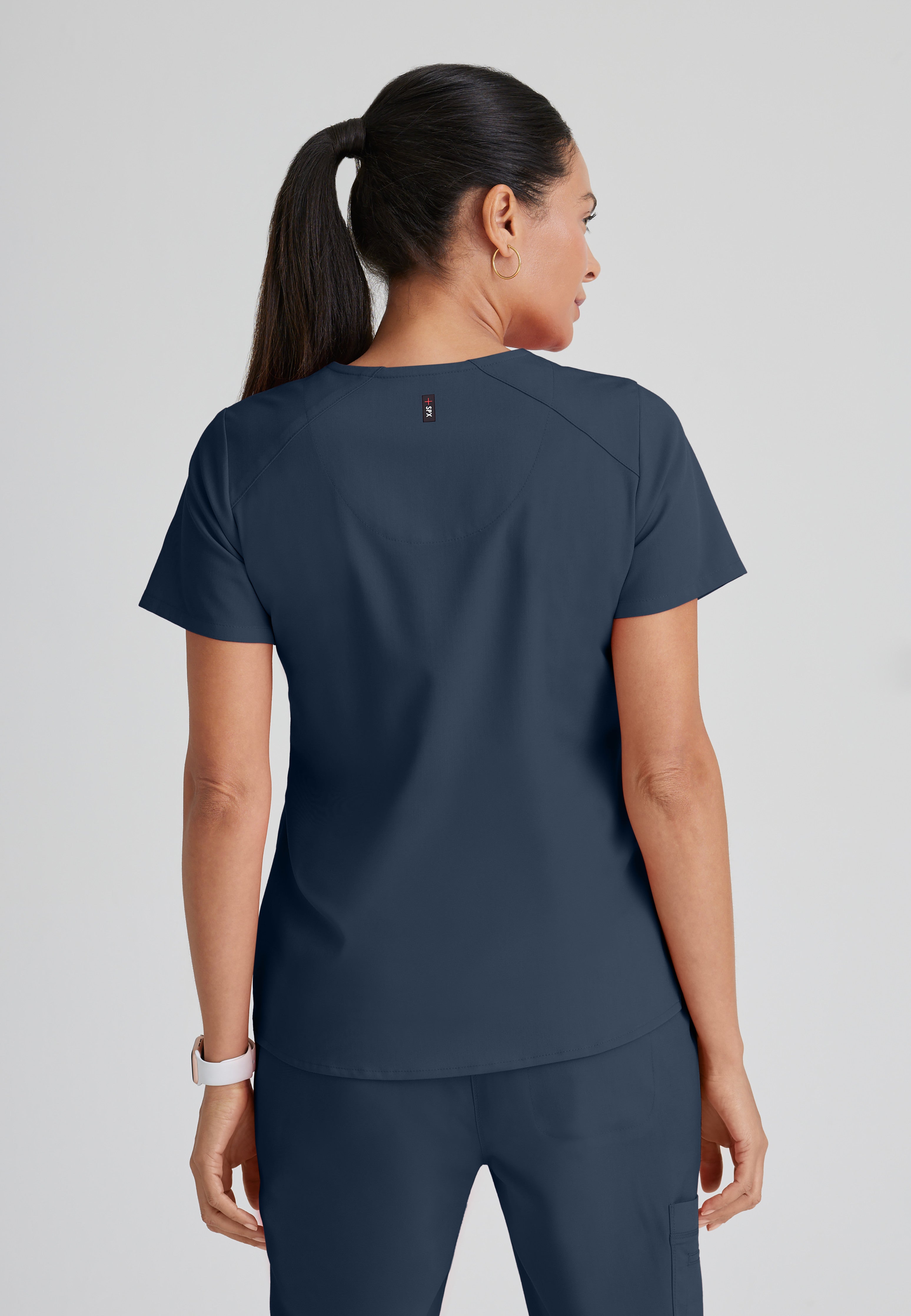 Back View of the Emma 4-Pocket V-Neck Scrub Top in Steel from Grey's Anatomy™ by Barco Spandex Stretch