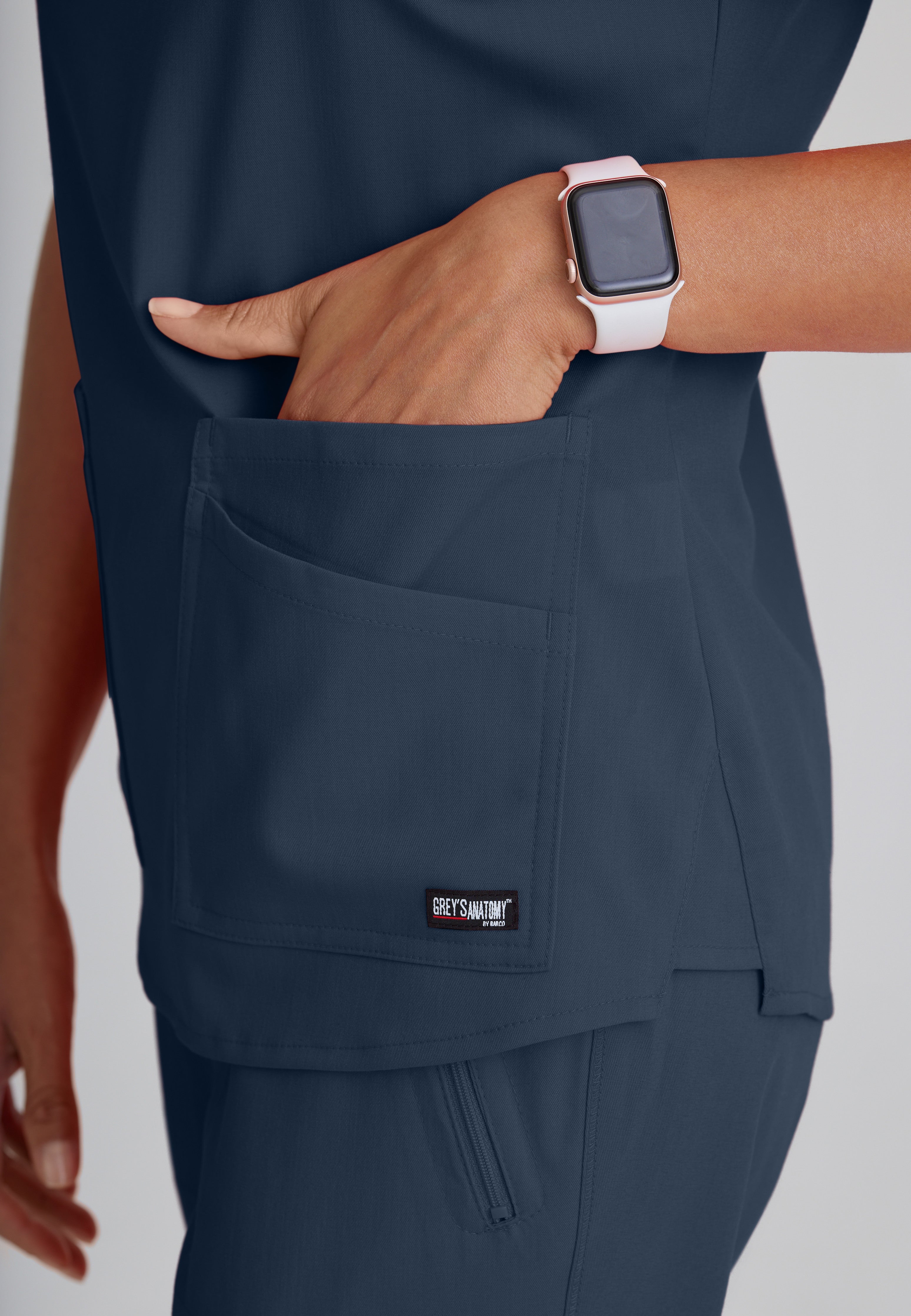 Detail Shot of the Emma 4-Pocket V-Neck Scrub Top in Steel from Grey's Anatomy™ by Barco Spandex Stretch