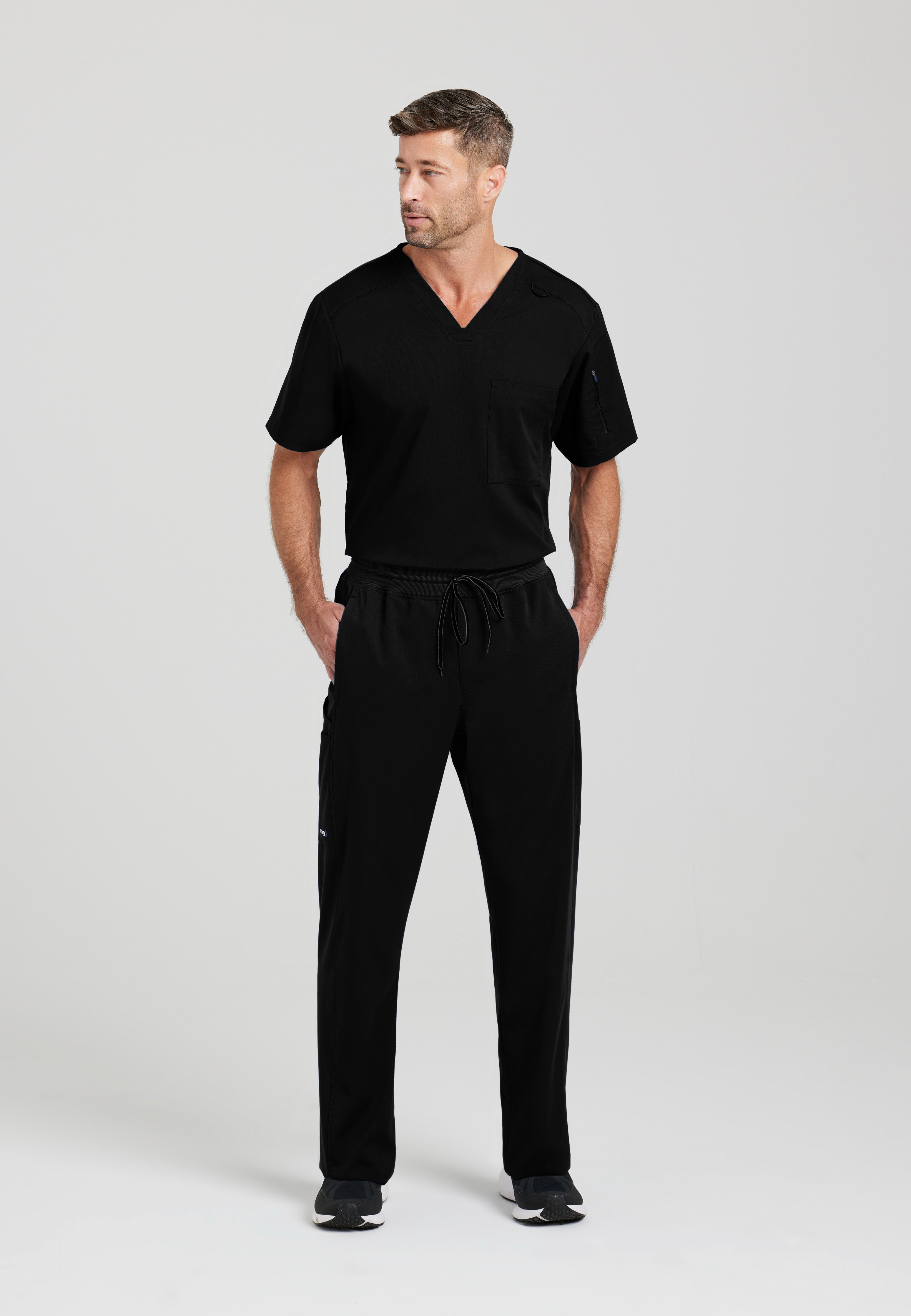 Full Body View of the Murphy 2-Pocket V-Neck Scrub Top in Black from Grey's Anatomy™ by Barco Spandex Stretch