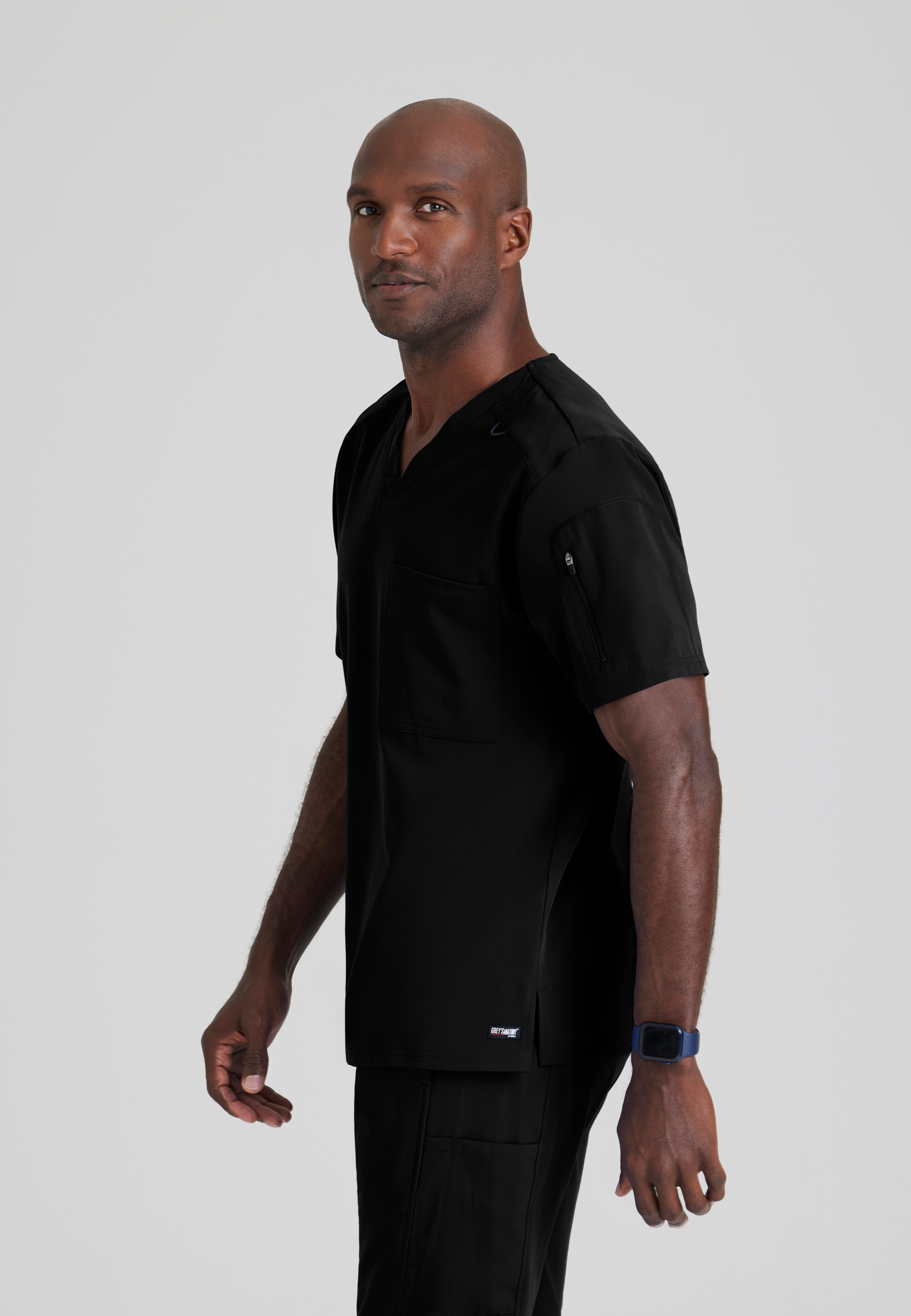Side View of the Murphy 2-Pocket V-Neck Scrub Top in Black from Grey's Anatomy™ by Barco Spandex Stretch