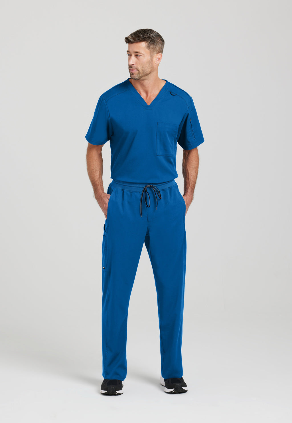 Full Body View of the Murphy 2-Pocket V-Neck Scrub Top in New Royal from Grey's Anatomy™ by Barco Spandex Stretch