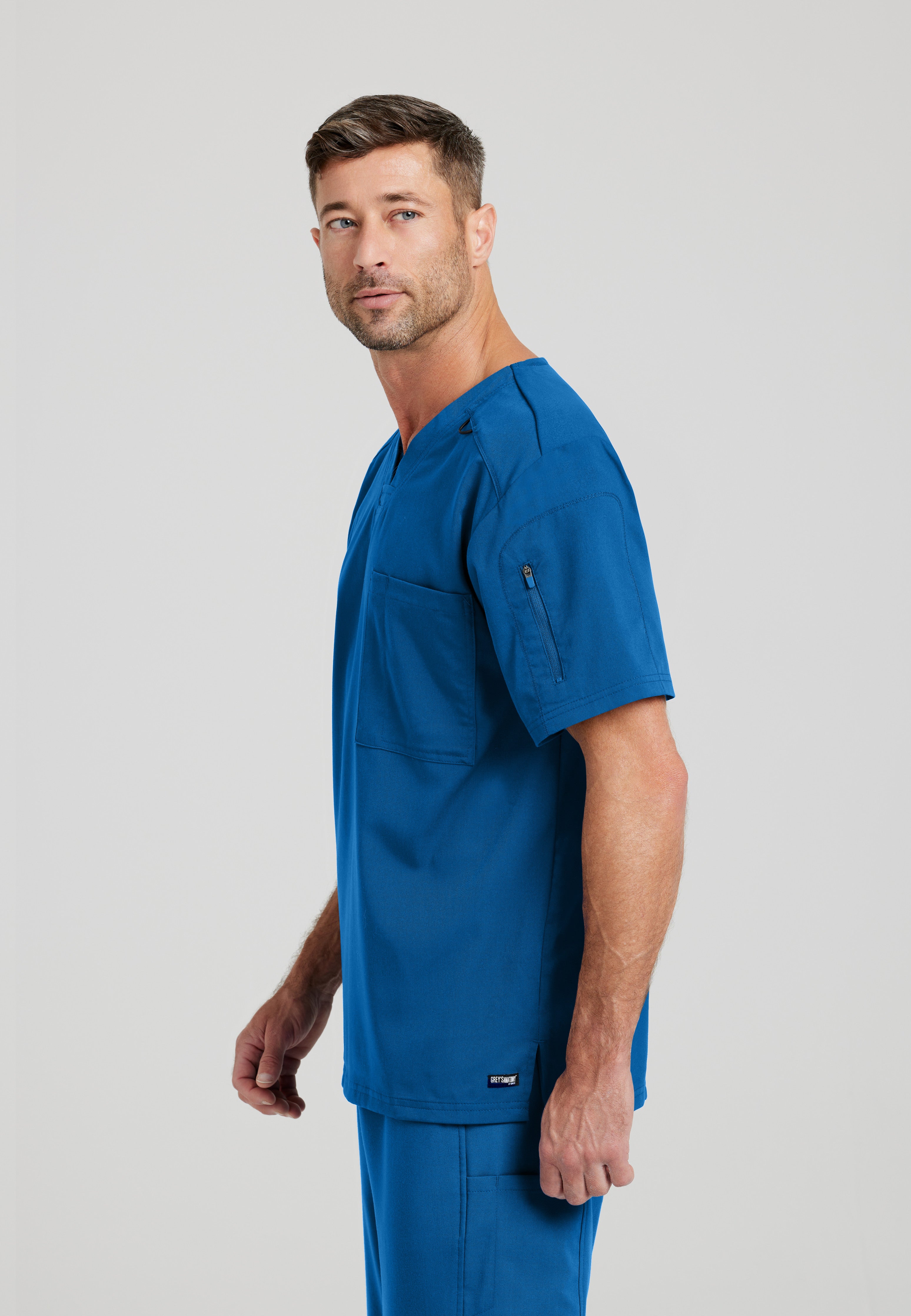 Side View of the Murphy 2-Pocket V-Neck Scrub Top in New Royal from Grey's Anatomy™ by Barco Spandex Stretch