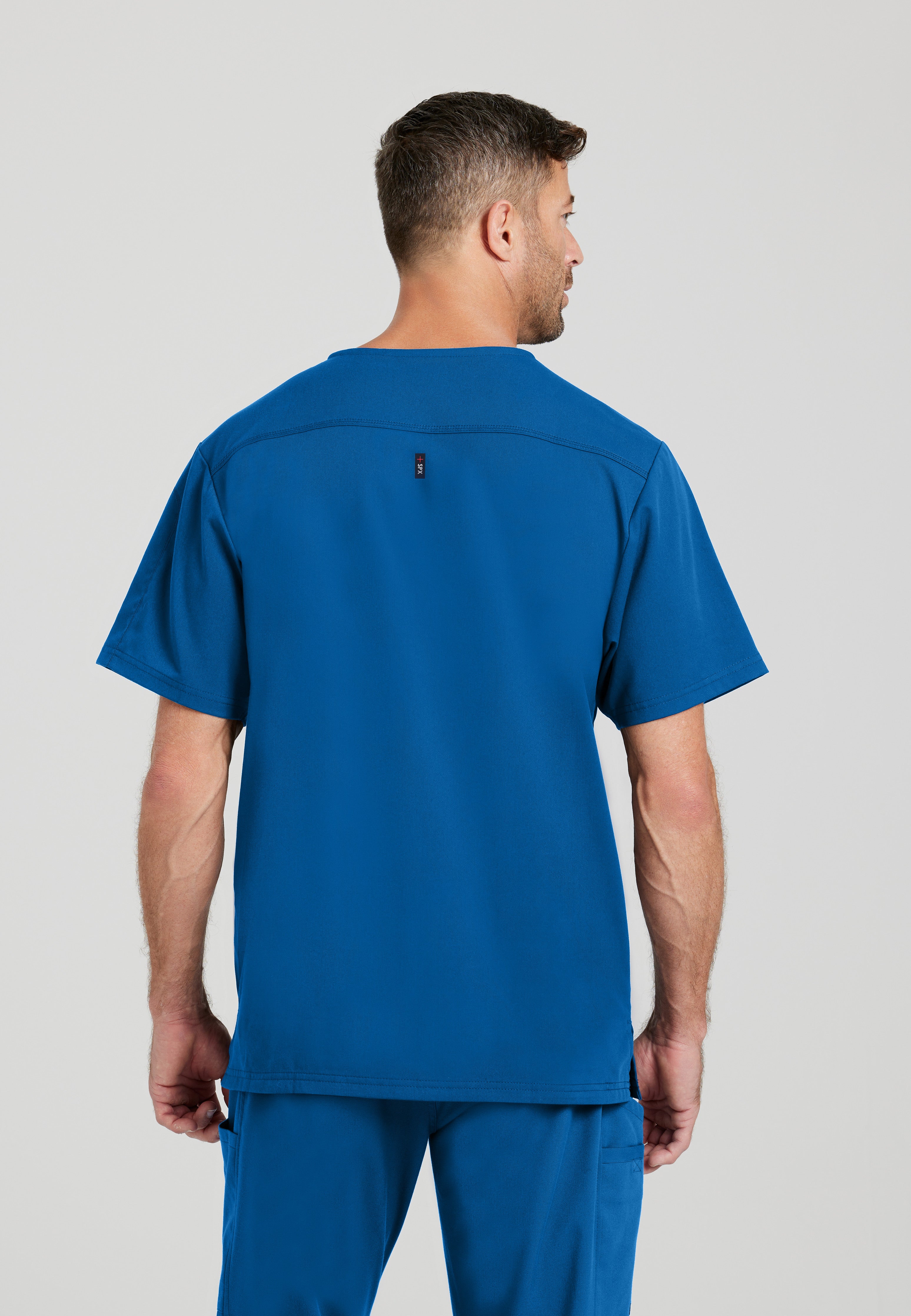 Back View of the Murphy 2-Pocket V-Neck Scrub Top in New Royal from Grey's Anatomy™ by Barco Spandex Stretch