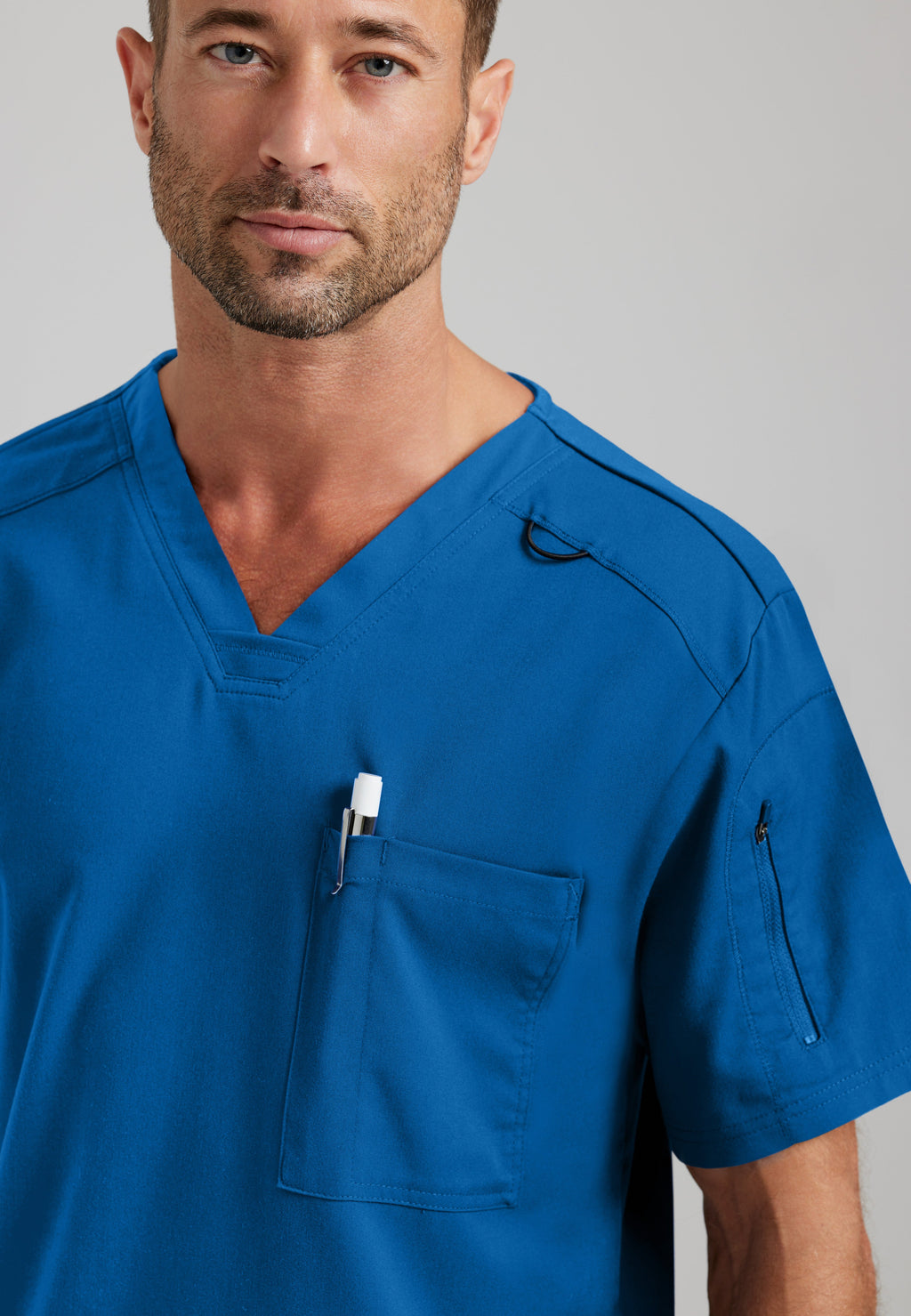 Detail Shot of the Murphy 2-Pocket V-Neck Scrub Top in New Royal from Grey's Anatomy™ by Barco Spandex Stretch