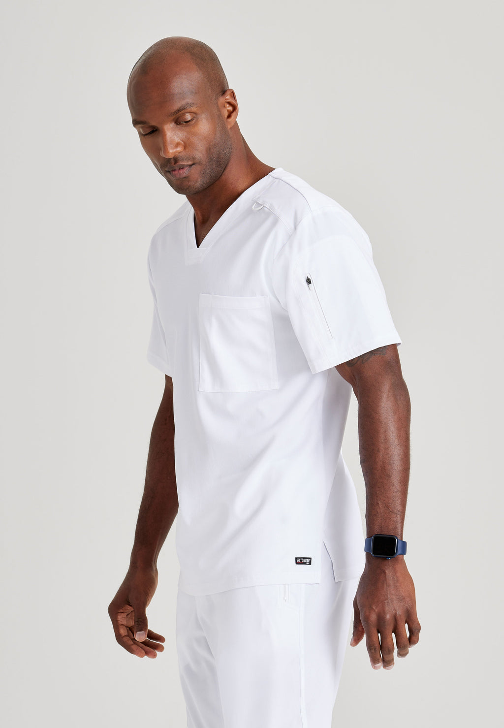 Grey's Anatomy Spandex-Stretch Men’s white Chest Pocket V-Neck Scrub Top. Bungee loop. Soft stretch fabric wicks moisture. 
