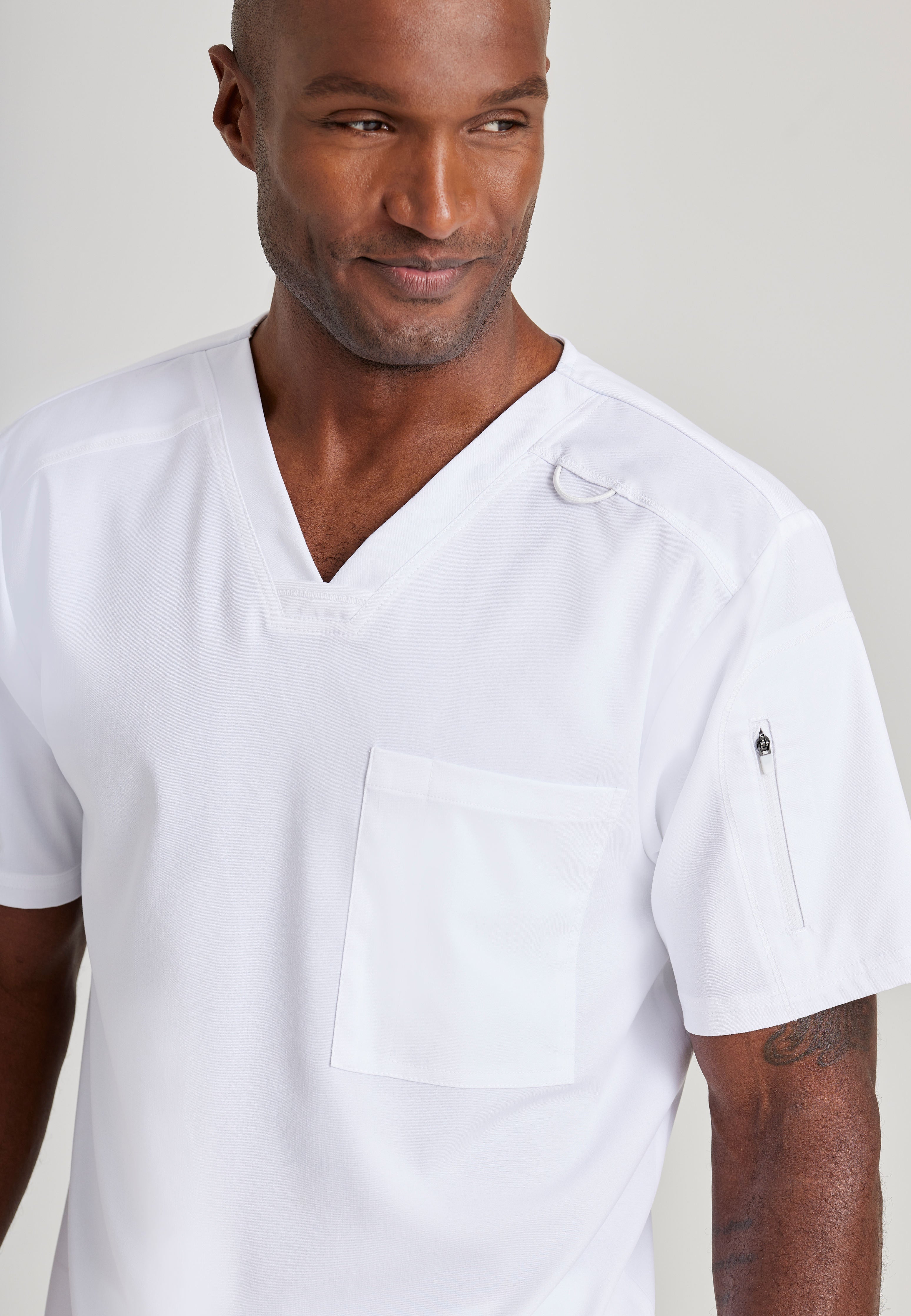 Grey's Anatomy Spandex-Stretch Men’s white Chest Pocket V-Neck Scrub Top. Bungee loop. Soft stretch fabric wicks moisture. 