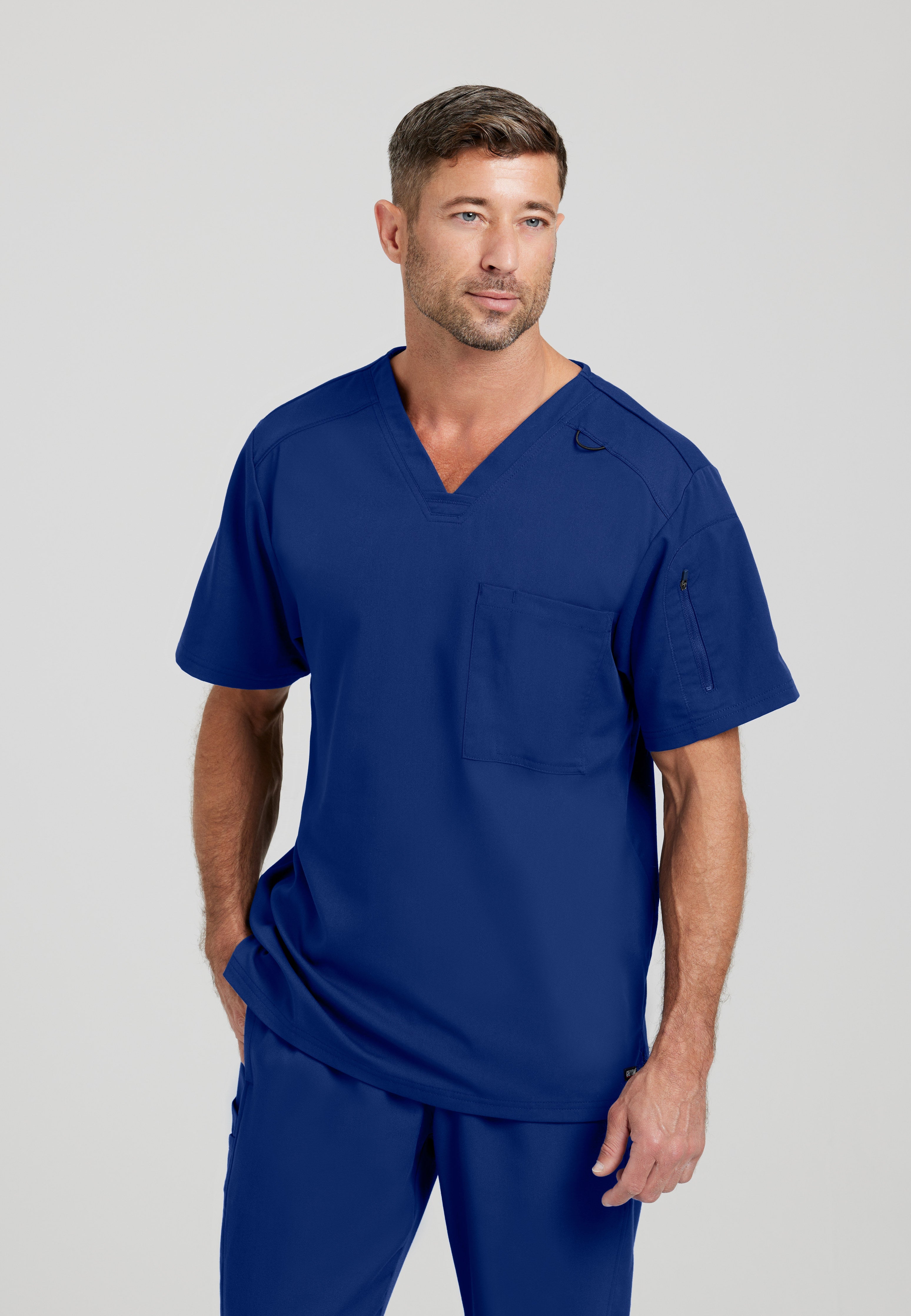 Front View of the Murphy 2-Pocket V-Neck Scrub Top in Indigo from Grey's Anatomy™ by Barco Spandex Stretch
