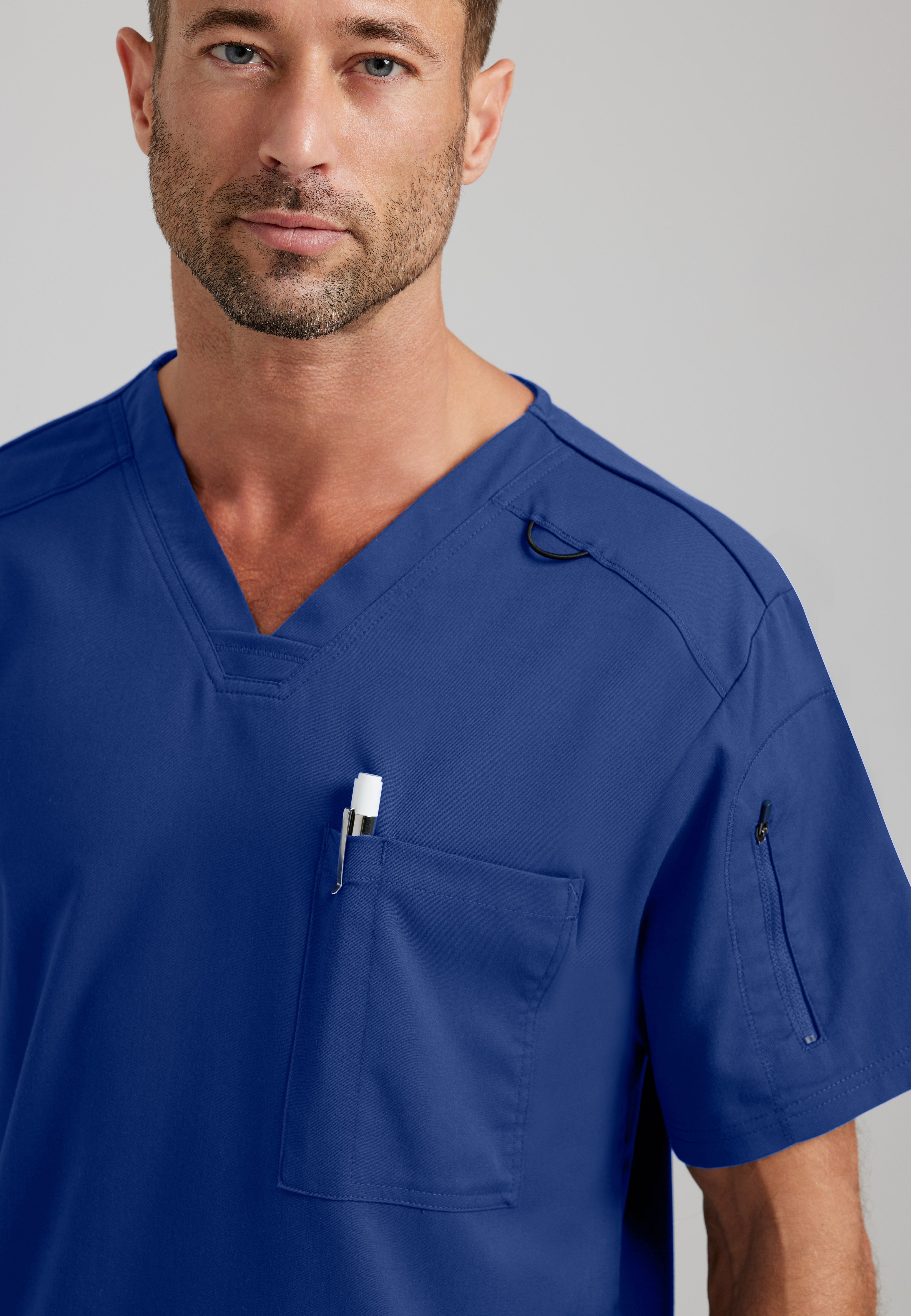 Detail Shot of the Murphy 2-Pocket V-Neck Scrub Top in Indigo from Grey's Anatomy™ by Barco Spandex Stretch