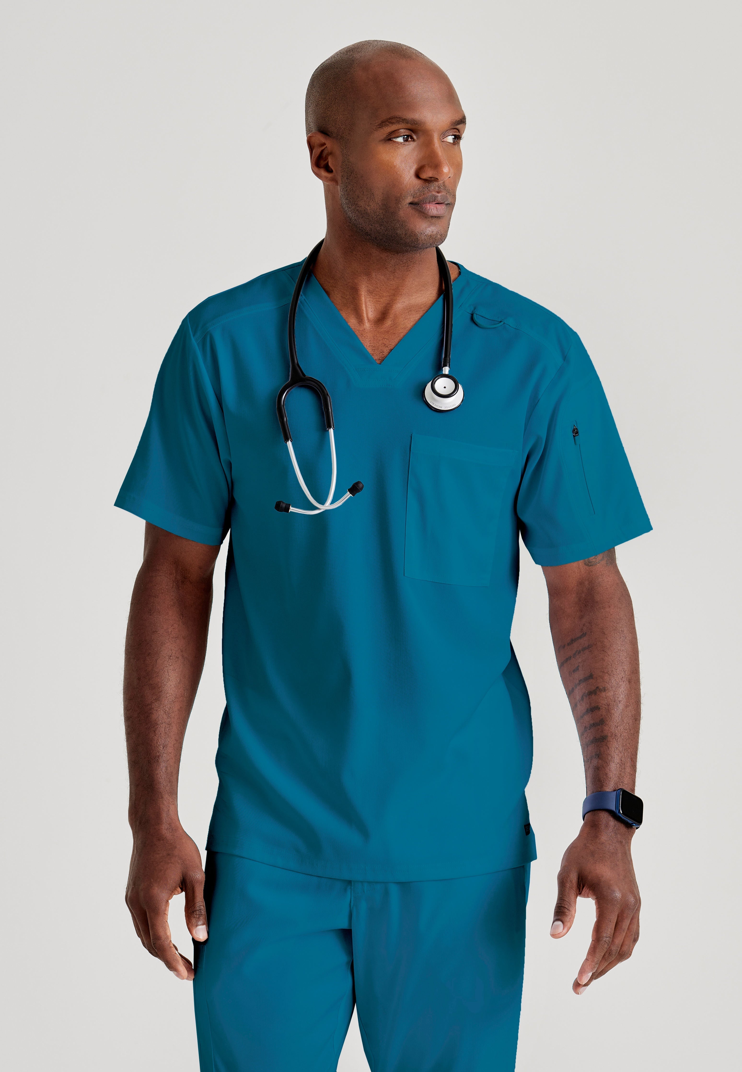 Grey's Anatomy Spandex-Stretch Men’s Bahama Chest Pocket V-Neck Scrub Top. Bungee loop. Soft stretch fabric wicks moisture. 