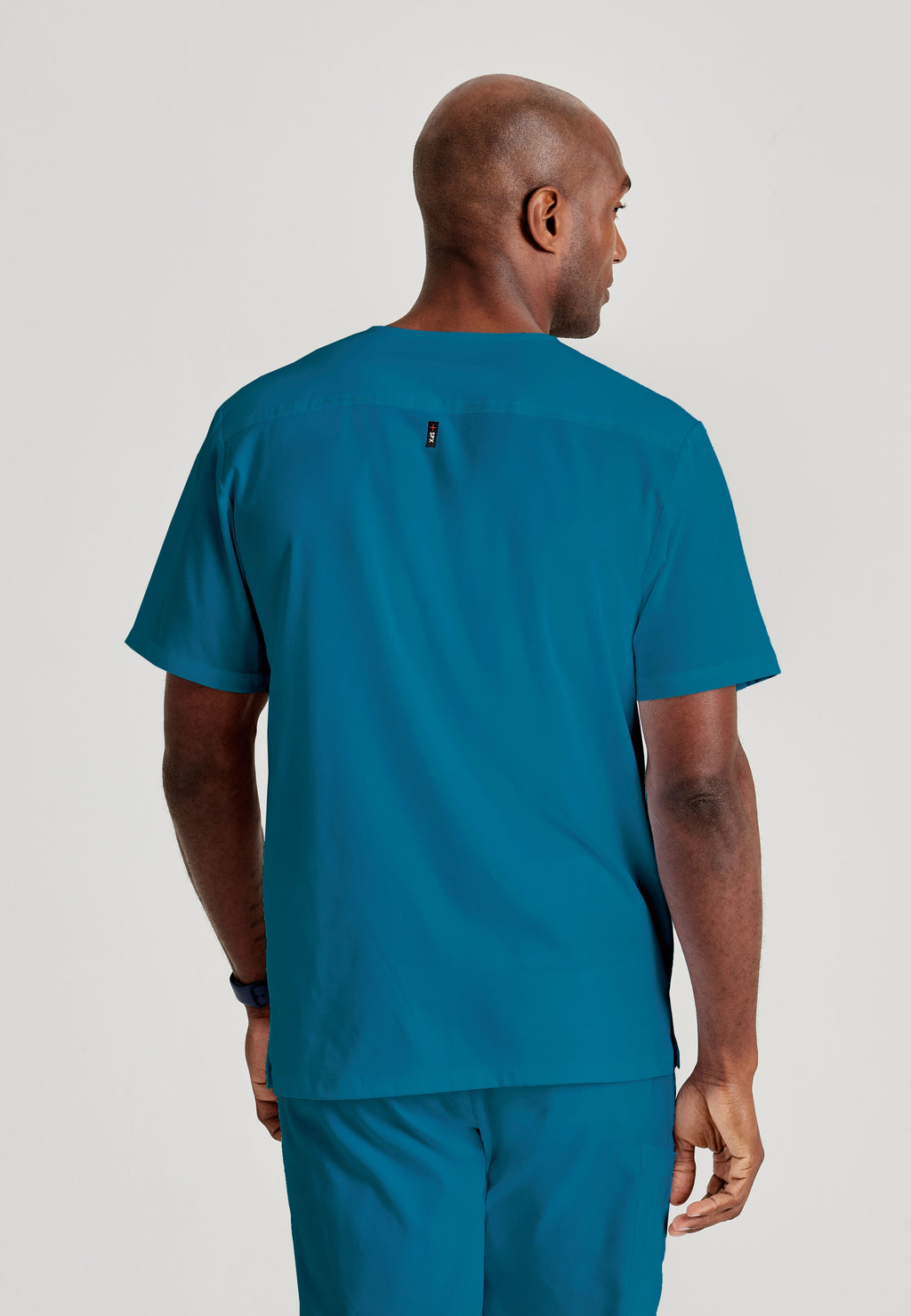 Grey's Anatomy Spandex-Stretch Men’s Bahama Chest Pocket V-Neck Scrub Top. Bungee loop. Soft stretch fabric wicks moisture. 