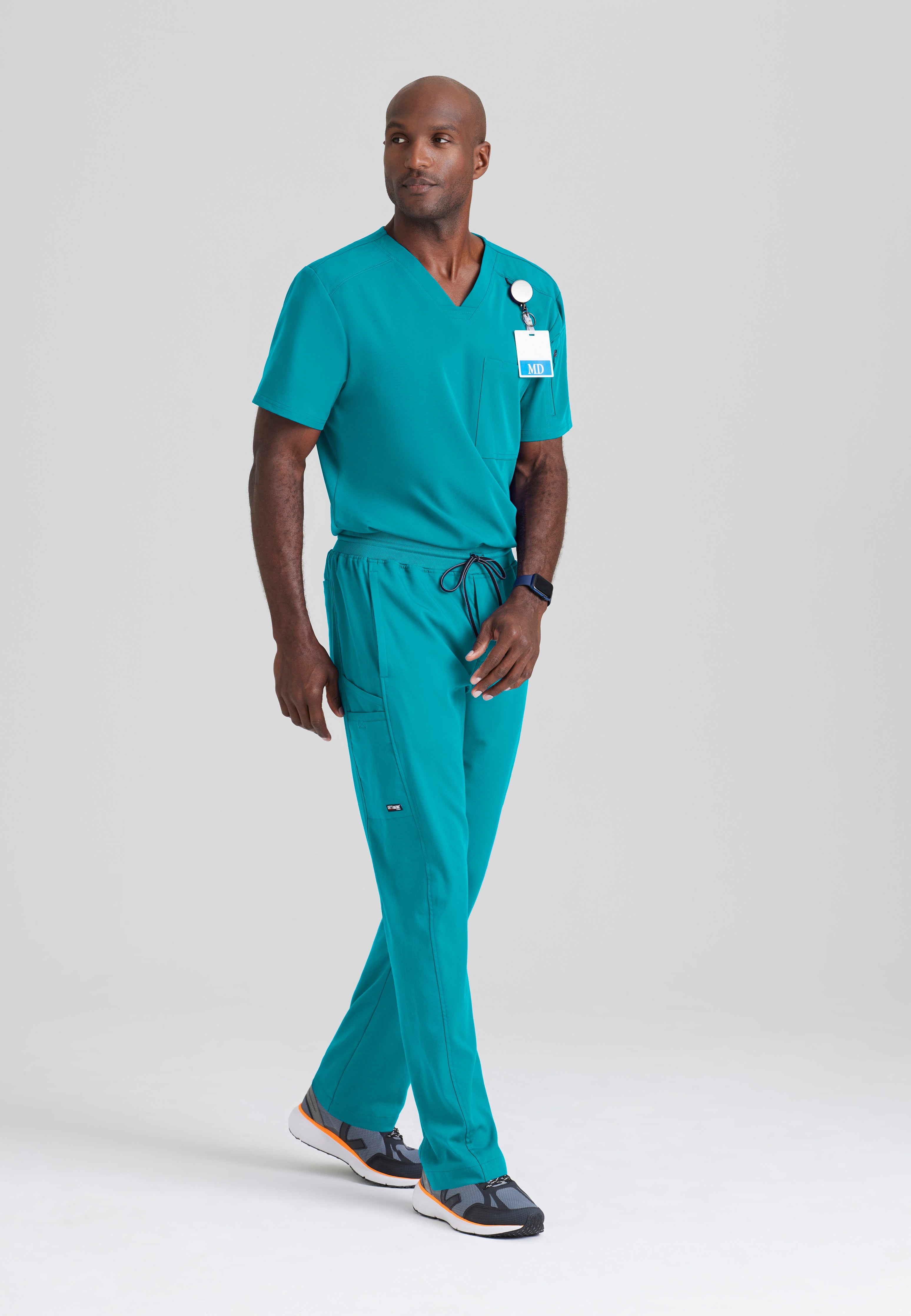 Full Body View of the Murphy 2-Pocket V-Neck Scrub Top in Teal from Grey's Anatomy™ by Barco Spandex Stretch