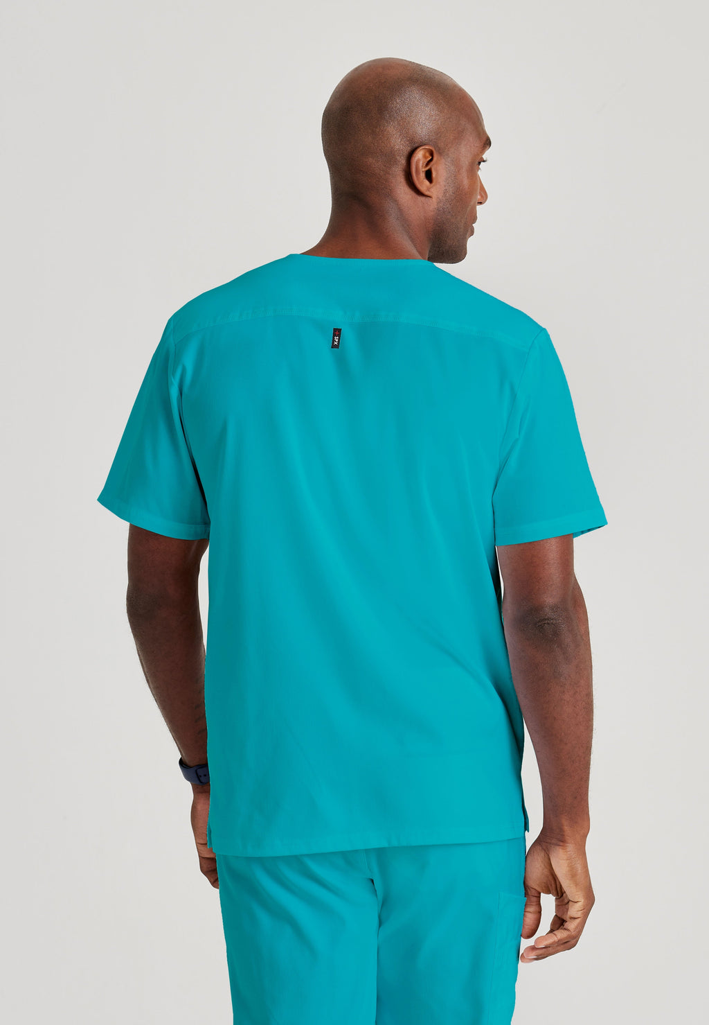 Grey's Anatomy Spandex-Stretch Men’s teal Chest Pocket V-Neck Scrub Top. Bungee loop. Soft stretch fabric wicks moisture. 
