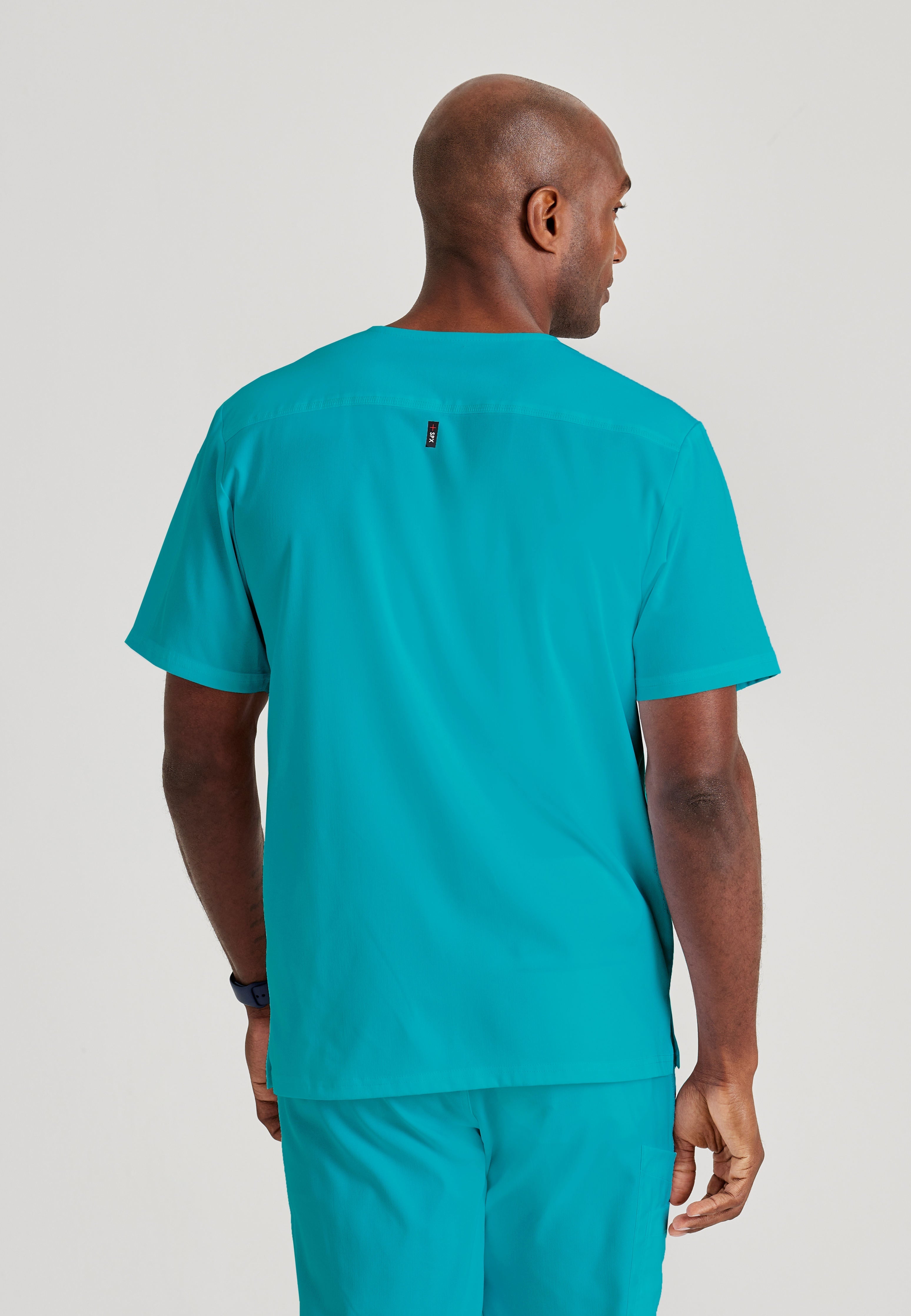 Grey's Anatomy Spandex-Stretch Men’s teal Chest Pocket V-Neck Scrub Top. Bungee loop. Soft stretch fabric wicks moisture. 