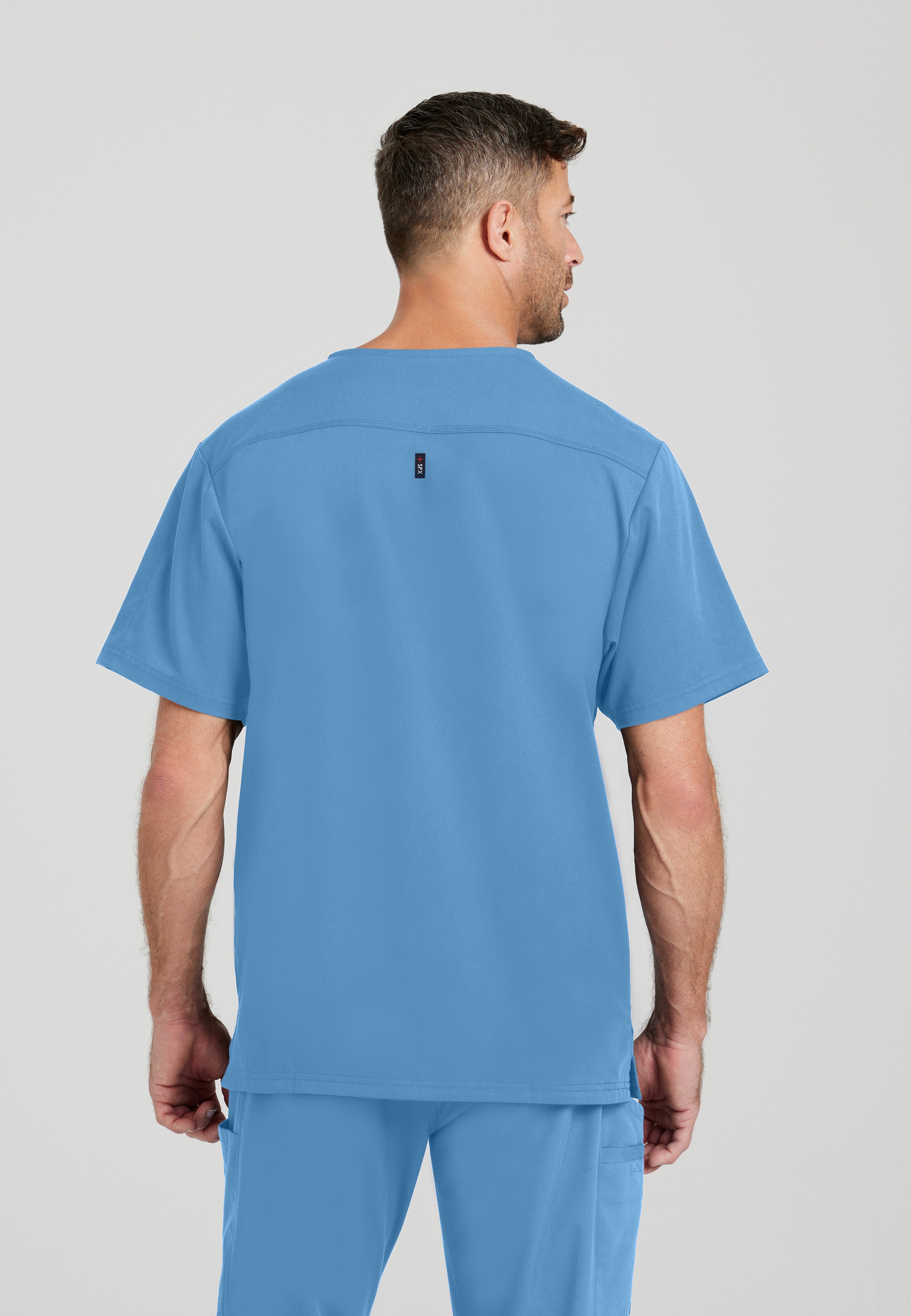 Back View of the Murphy 2-Pocket V-Neck Scrub Top in Ciel Blue from Grey's Anatomy™ by Barco Spandex Stretch