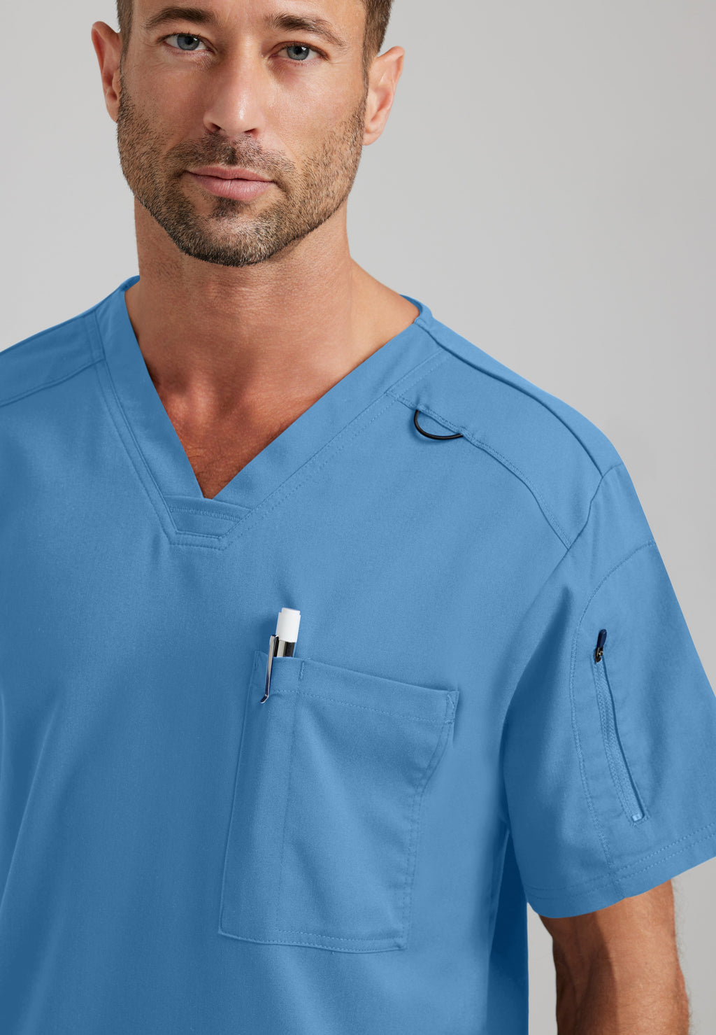 Detail Shot of the Murphy 2-Pocket V-Neck Scrub Top in Ciel Blue from Grey's Anatomy™ by Barco Spandex Stretch