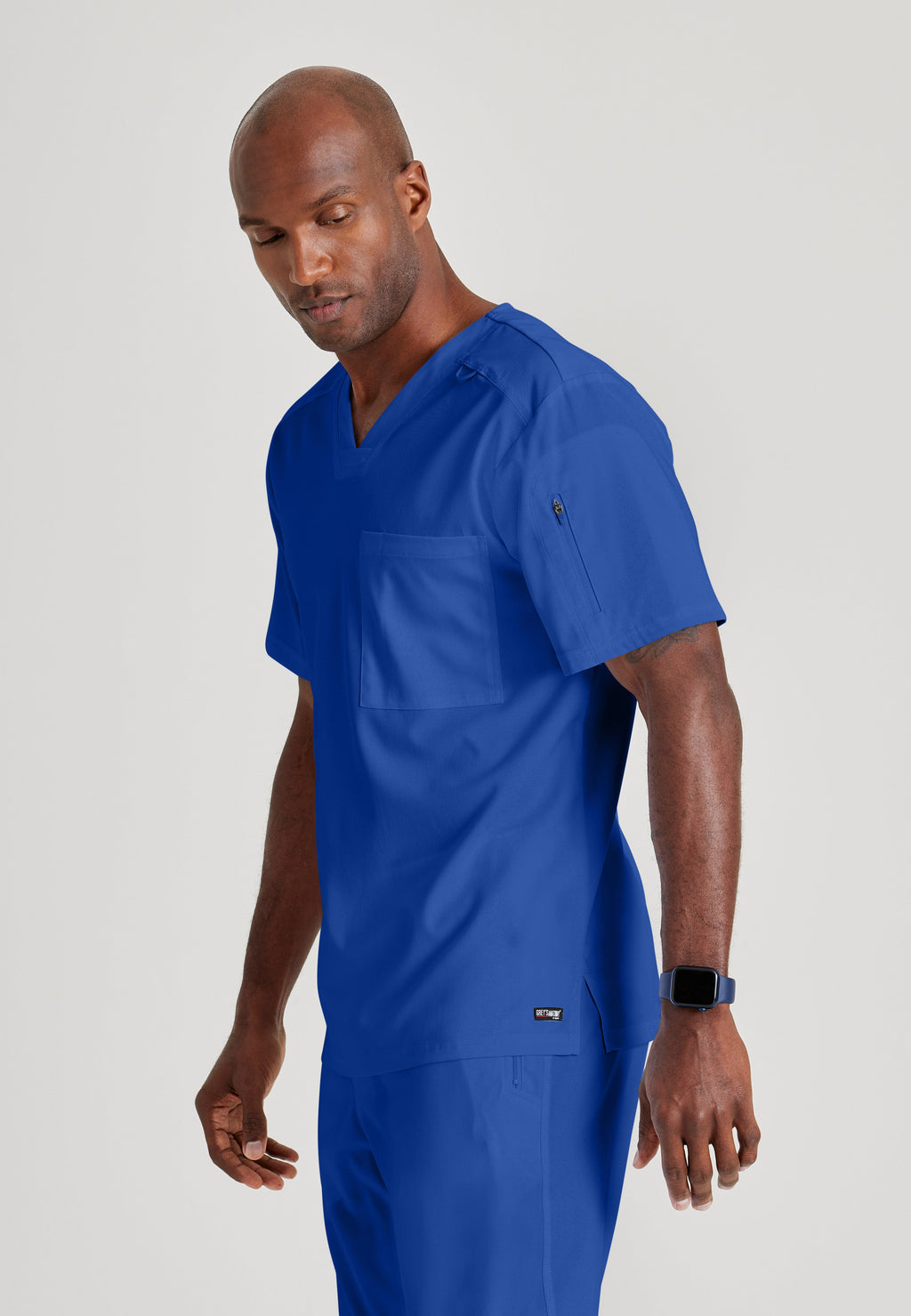 Side View of the Murphy 2-Pocket V-Neck Scrub Top in Galaxy from Grey's Anatomy™ by Barco Spandex Stretch