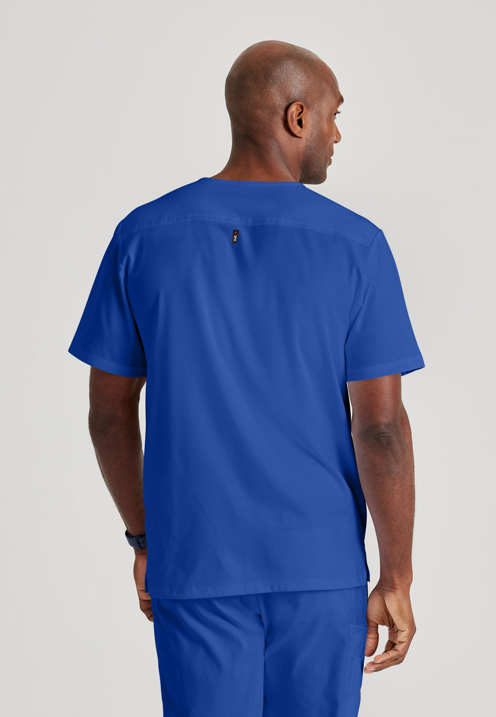 Back View of the Murphy 2-Pocket V-Neck Scrub Top in Galaxy from Grey's Anatomy™ by Barco Spandex Stretch