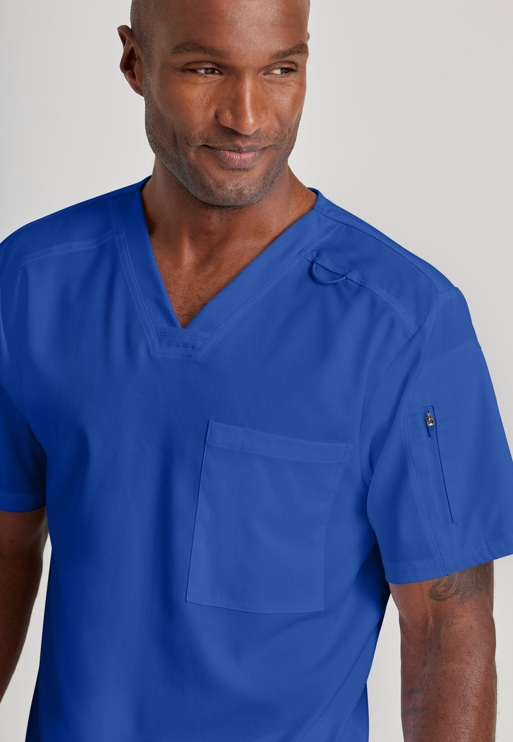 Detail Shot of the Murphy 2-Pocket V-Neck Scrub Top in Galaxy from Grey's Anatomy™ by Barco Spandex Stretch