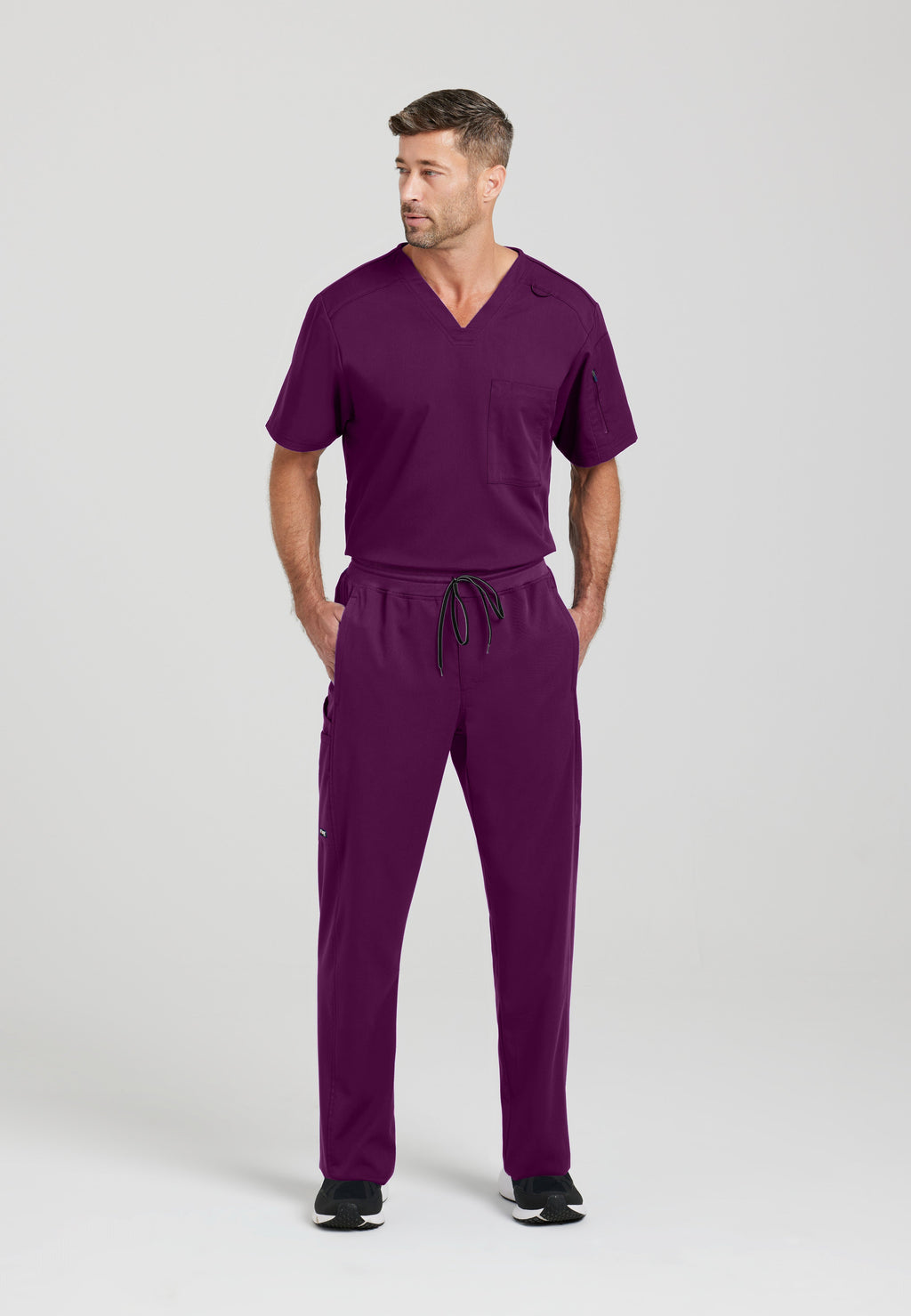 Full Body View of the Murphy 2-Pocket V-Neck Scrub Top in Wine from Grey's Anatomy™ by Barco Spandex Stretch