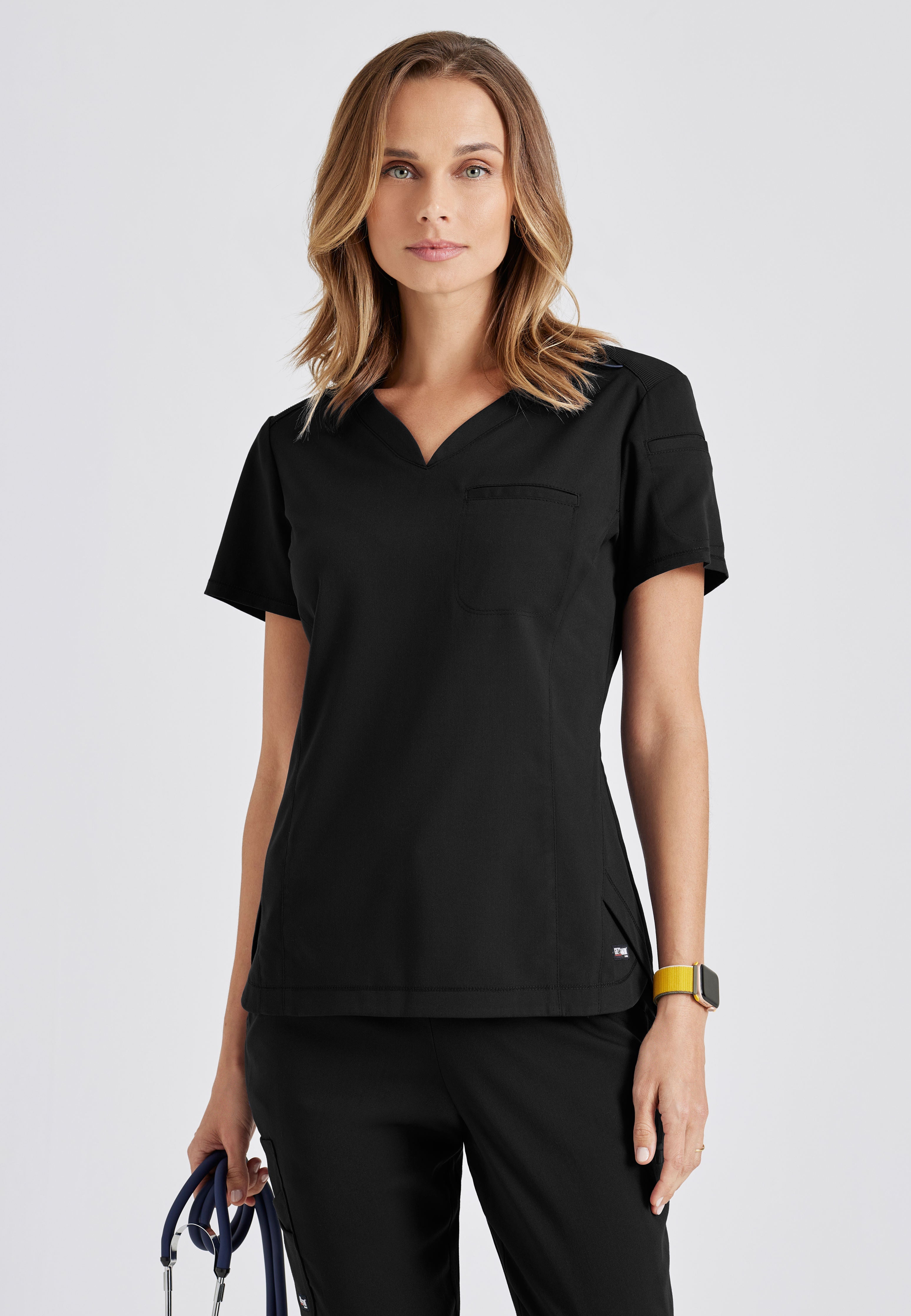 Front View of the Capri 2-Pocket Hourglass V-Neck Scrub Top in Black from Grey's Anatomy™ by Barco Spandex Stretch