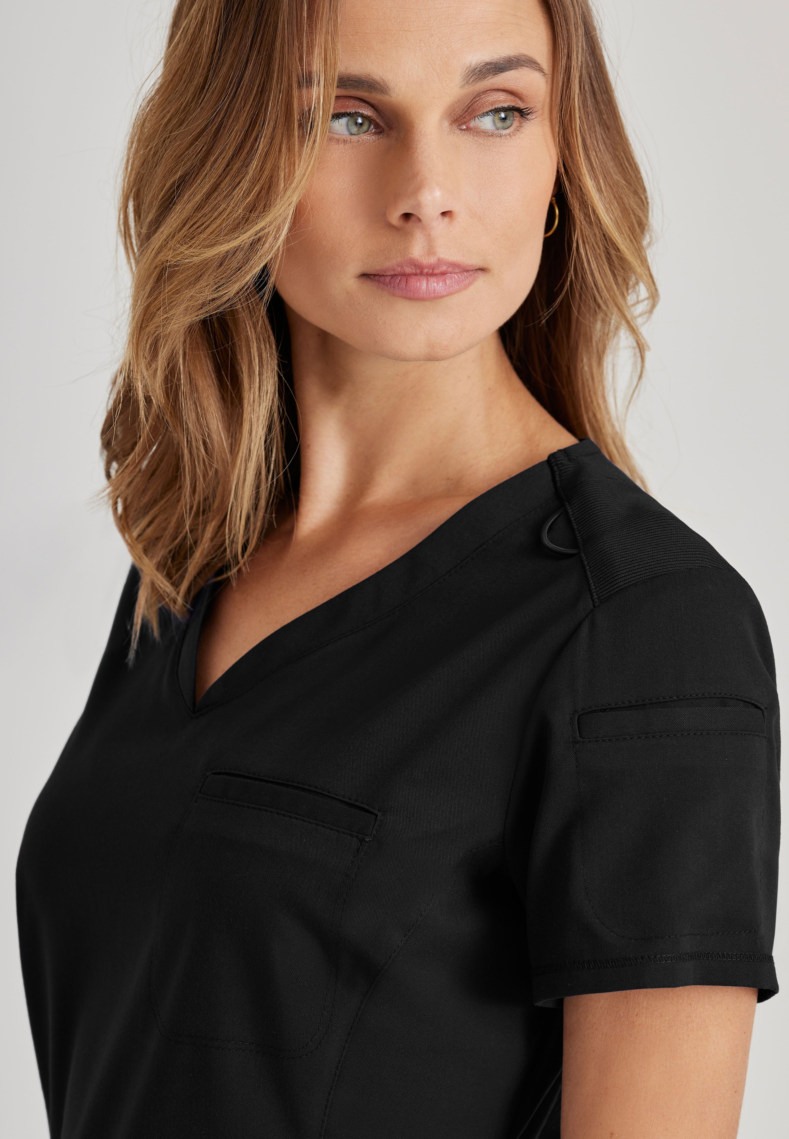 Detail Shot of the Capri 2-Pocket Hourglass V-Neck Scrub Top in Black from Grey's Anatomy™ by Barco Spandex Stretch