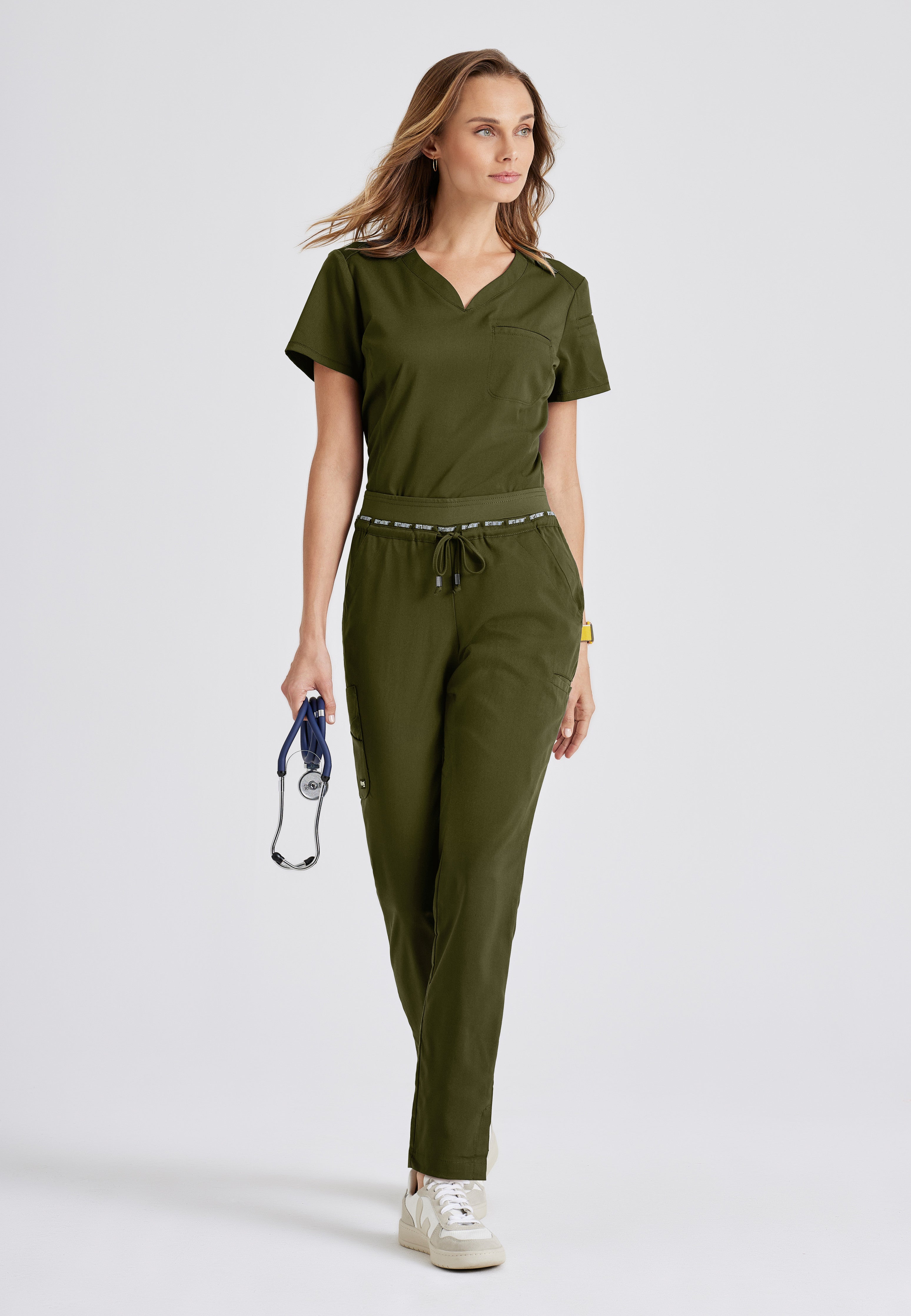 Full Body View of the Capri Tuck-in Scrub Top in Olive from Grey's Anatomy™ by Barco Spandex Stretch