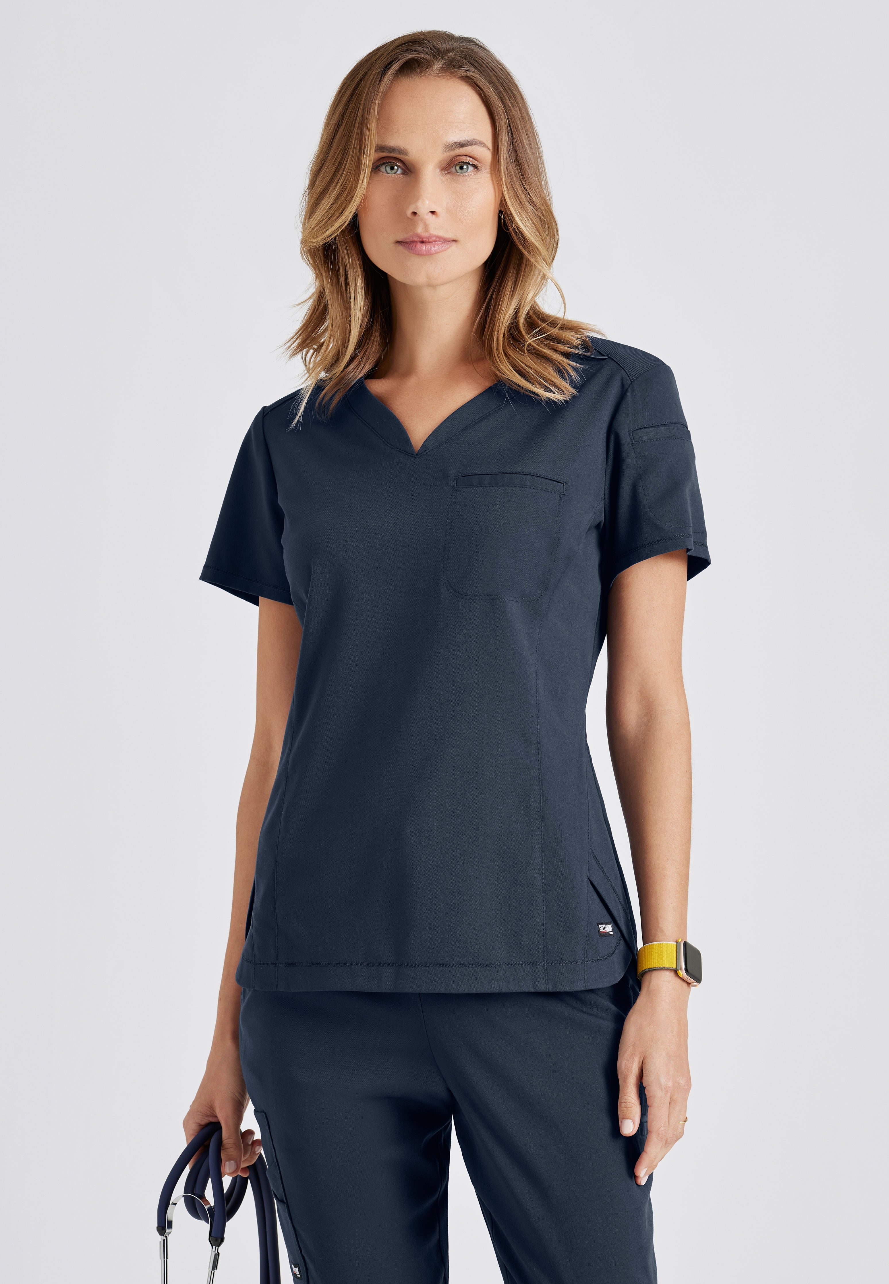 Front View of the Capri 2-Pocket Hourglass V-Neck Scrub Top in Steel from Grey's Anatomy™ by Barco Spandex Stretch