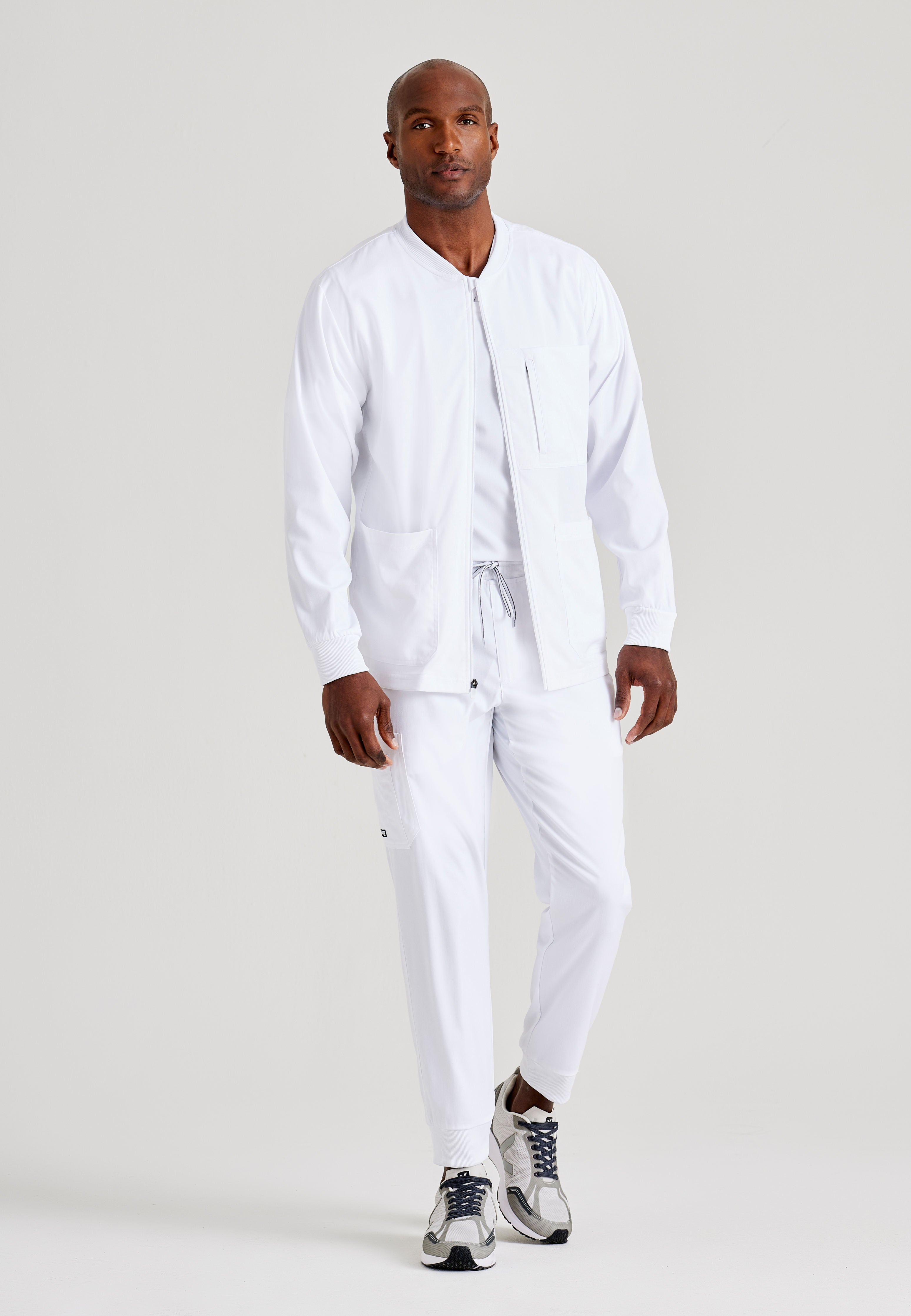 Grey's Anatomy Spandex-Stretch Men’s white Warm-Up Scrub Jacket. Zip front with chin guard. Ribbed sleeve cuffs. 