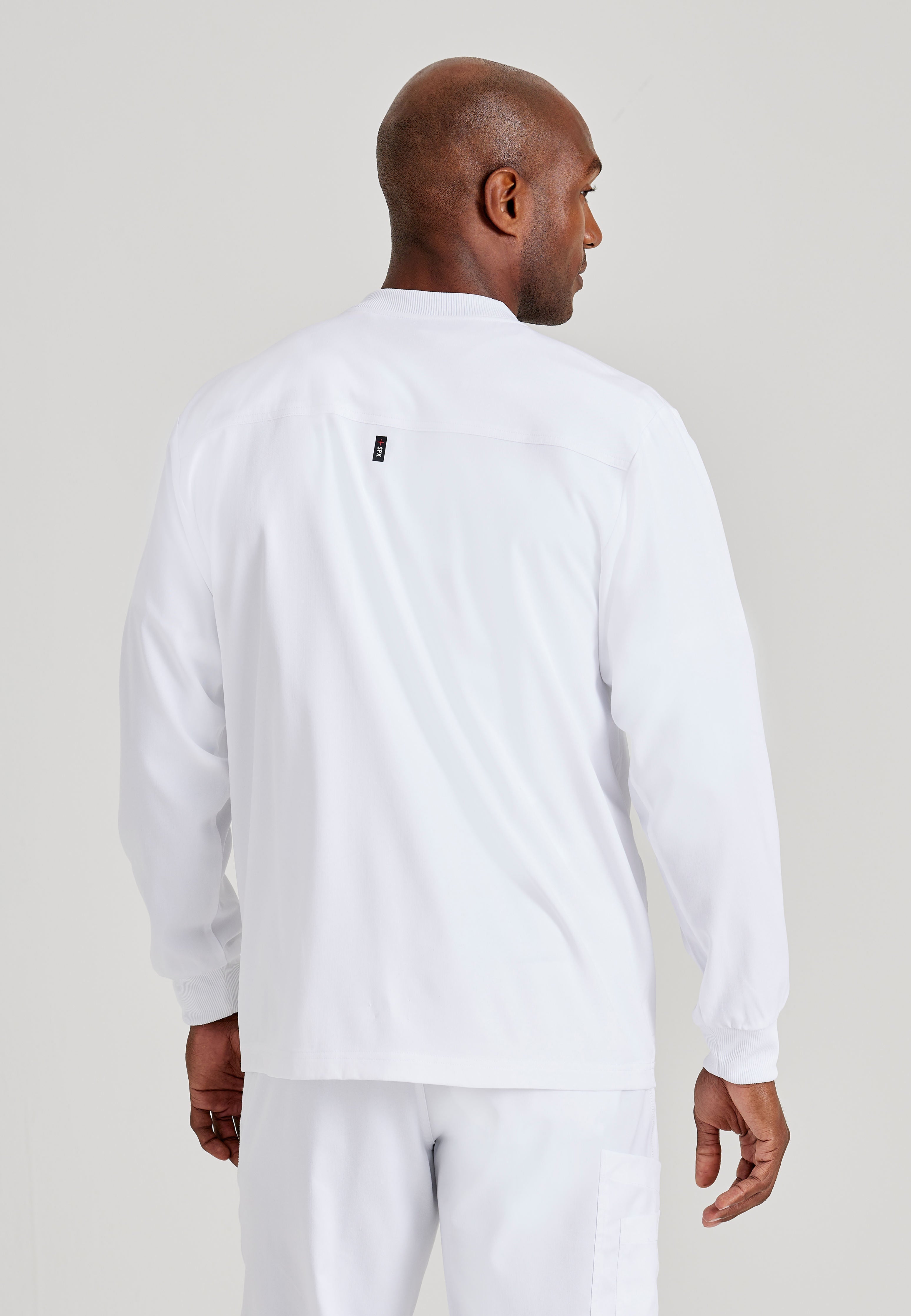 Grey's Anatomy Spandex-Stretch Men’s white Warm-Up Scrub Jacket. Zip front with chin guard. Ribbed sleeve cuffs. 