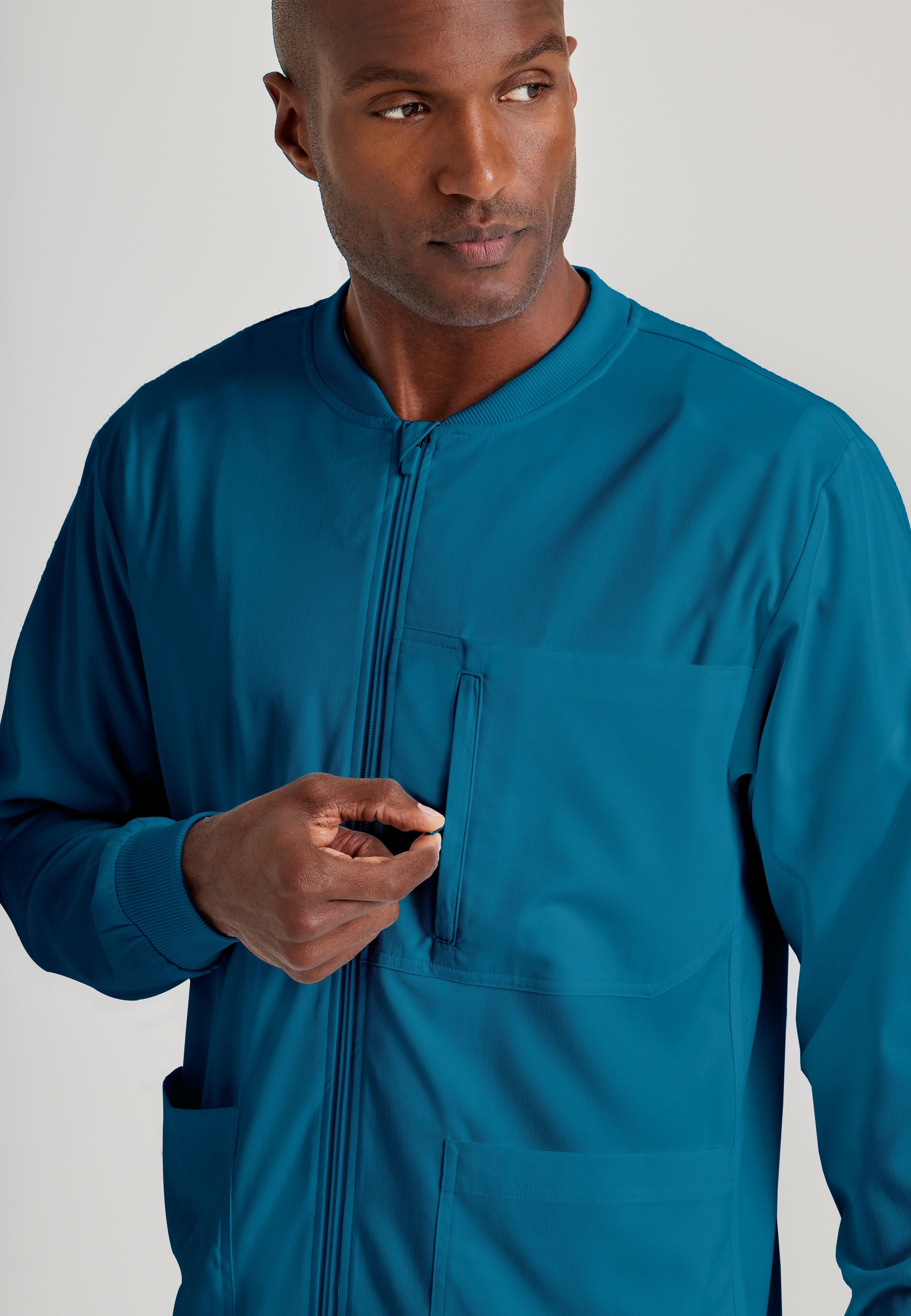 Grey's Anatomy Spandex-Stretch Men’s Bahama Warm-Up Scrub Jacket. Zip front with chin guard. Ribbed sleeve cuffs. 