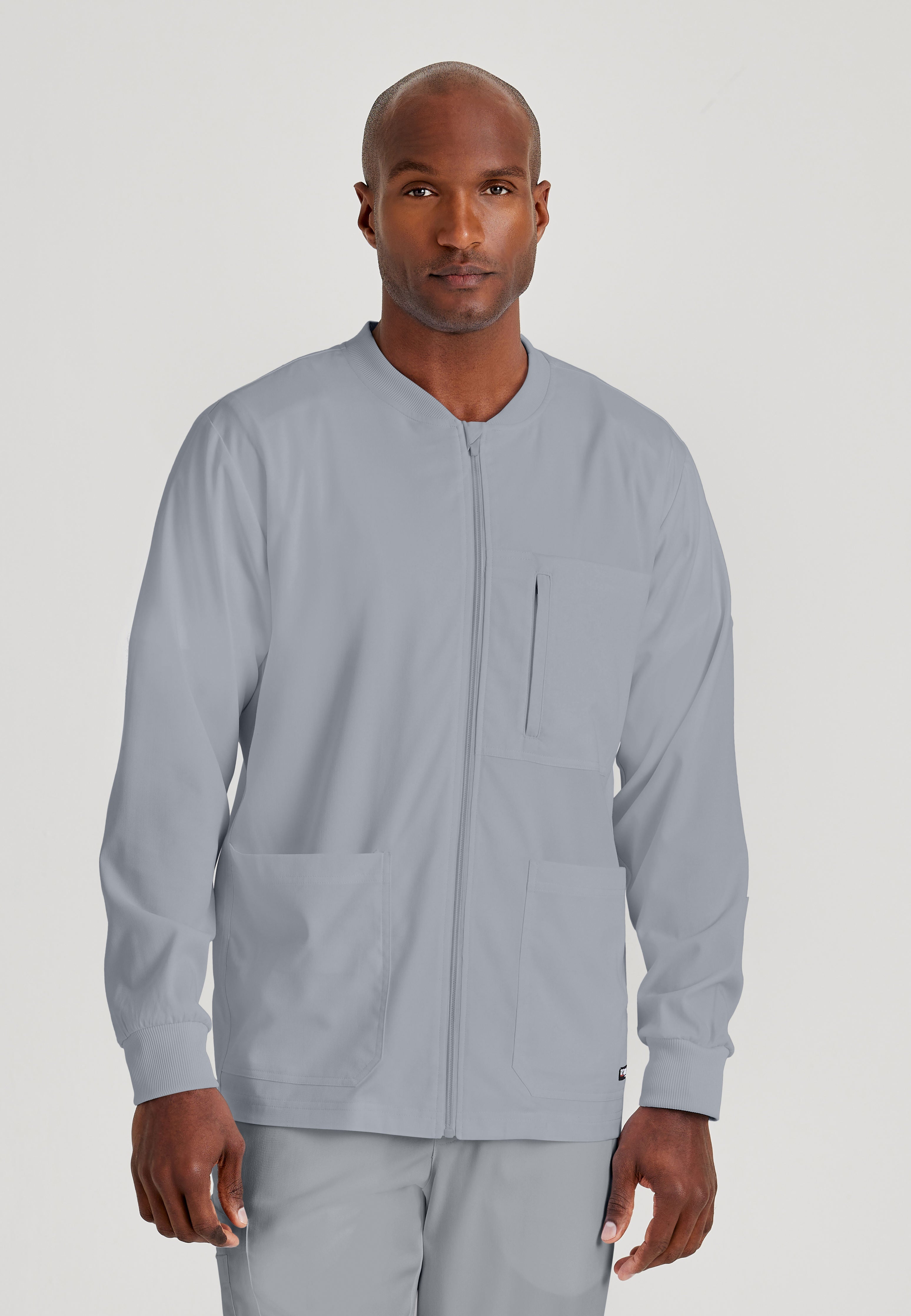 Front View of the React 5-Pocket Crewneck Warmup Scrub Jacket in Moonstruck from Grey's Anatomy™ by Barco Spandex Stretch