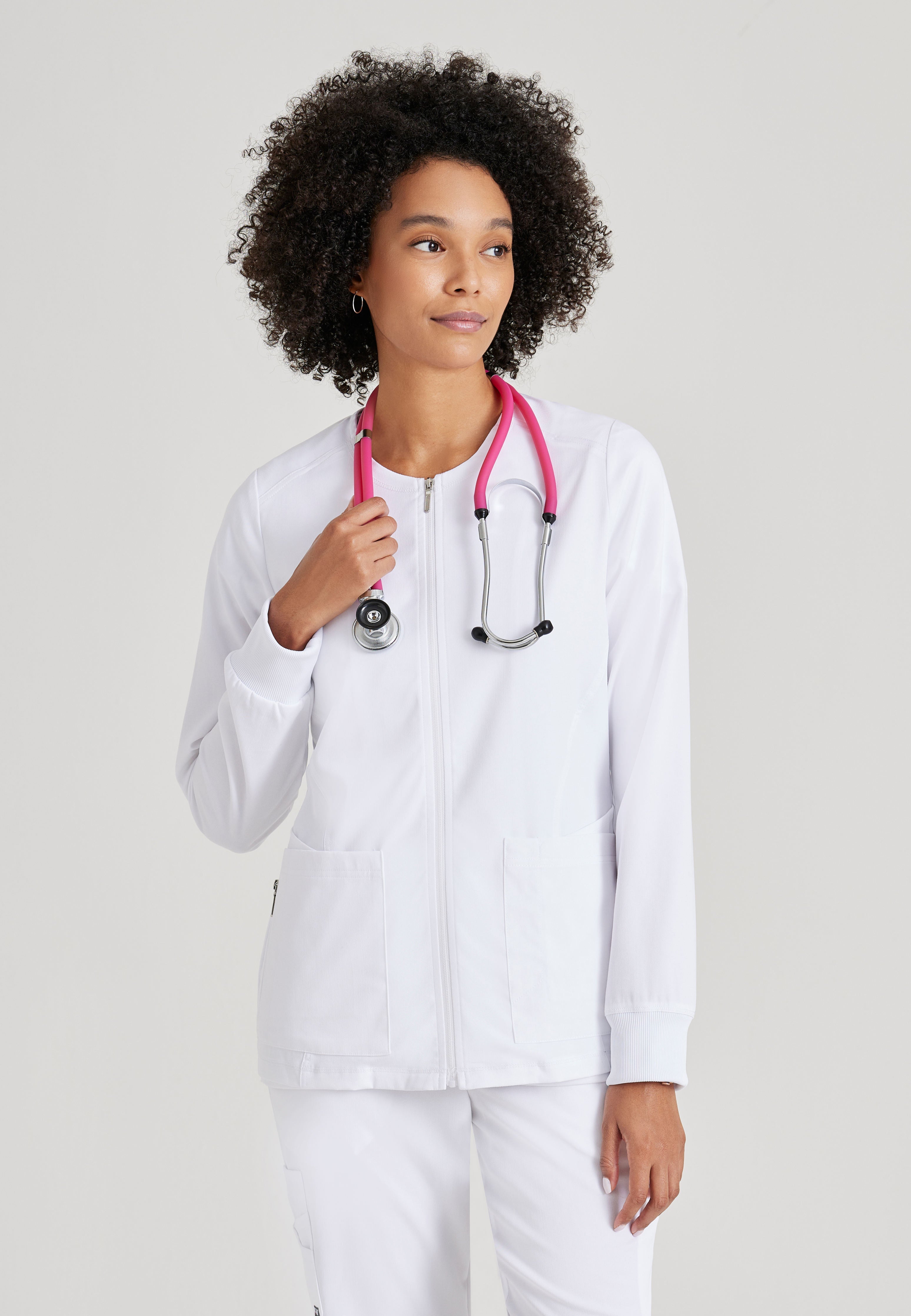 Grey's Anatomy Spandex-Stretch Women’s White Warm-Up Scrub Jacket. Zip front round neck. 5 pockets. Rib cuff sleeve. 