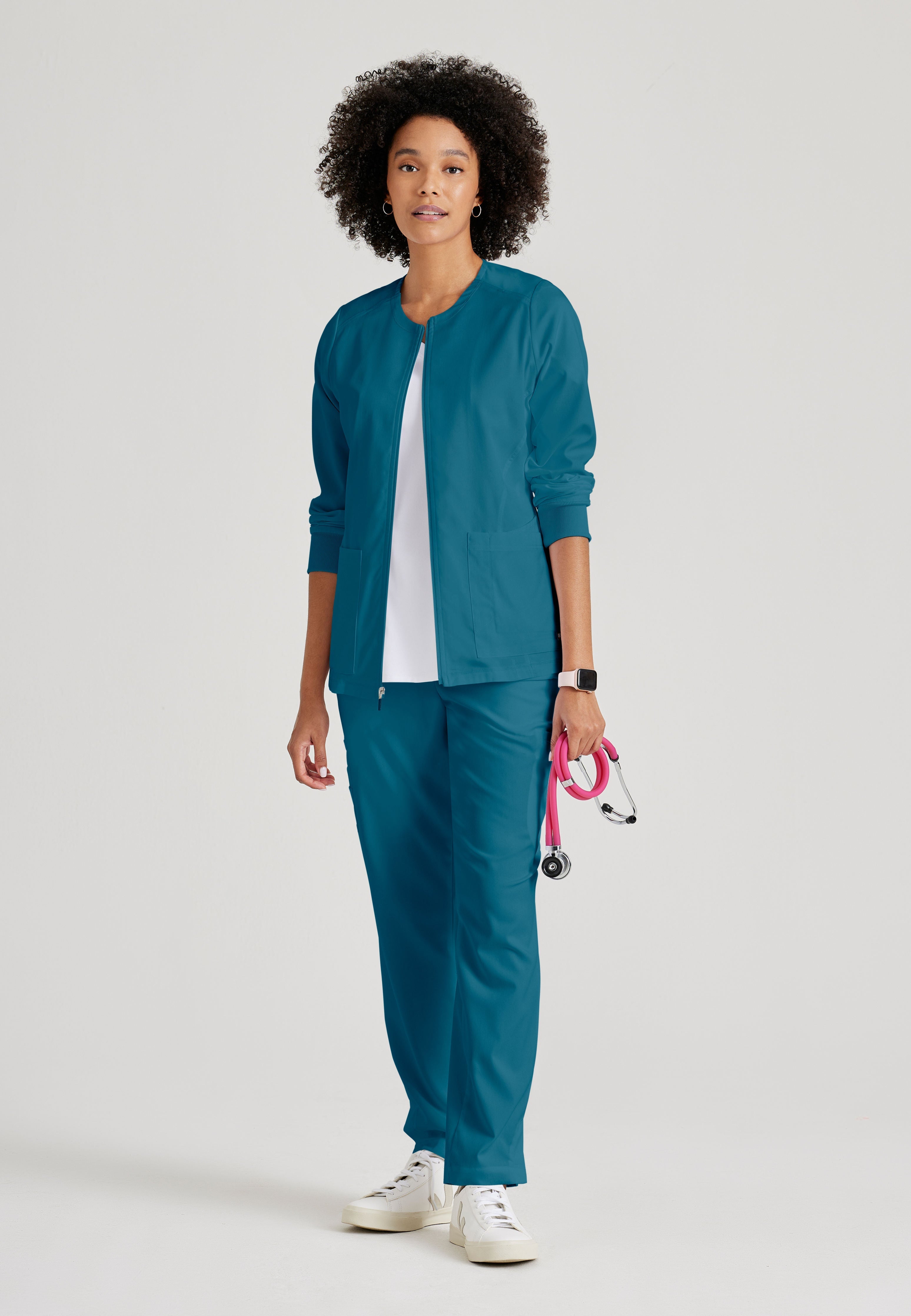 Grey's Anatomy Spandex-Stretch Women’s Bahama Warm-Up Scrub Jacket. Zip front round neck. 5 pockets. Rib cuff sleeve. 