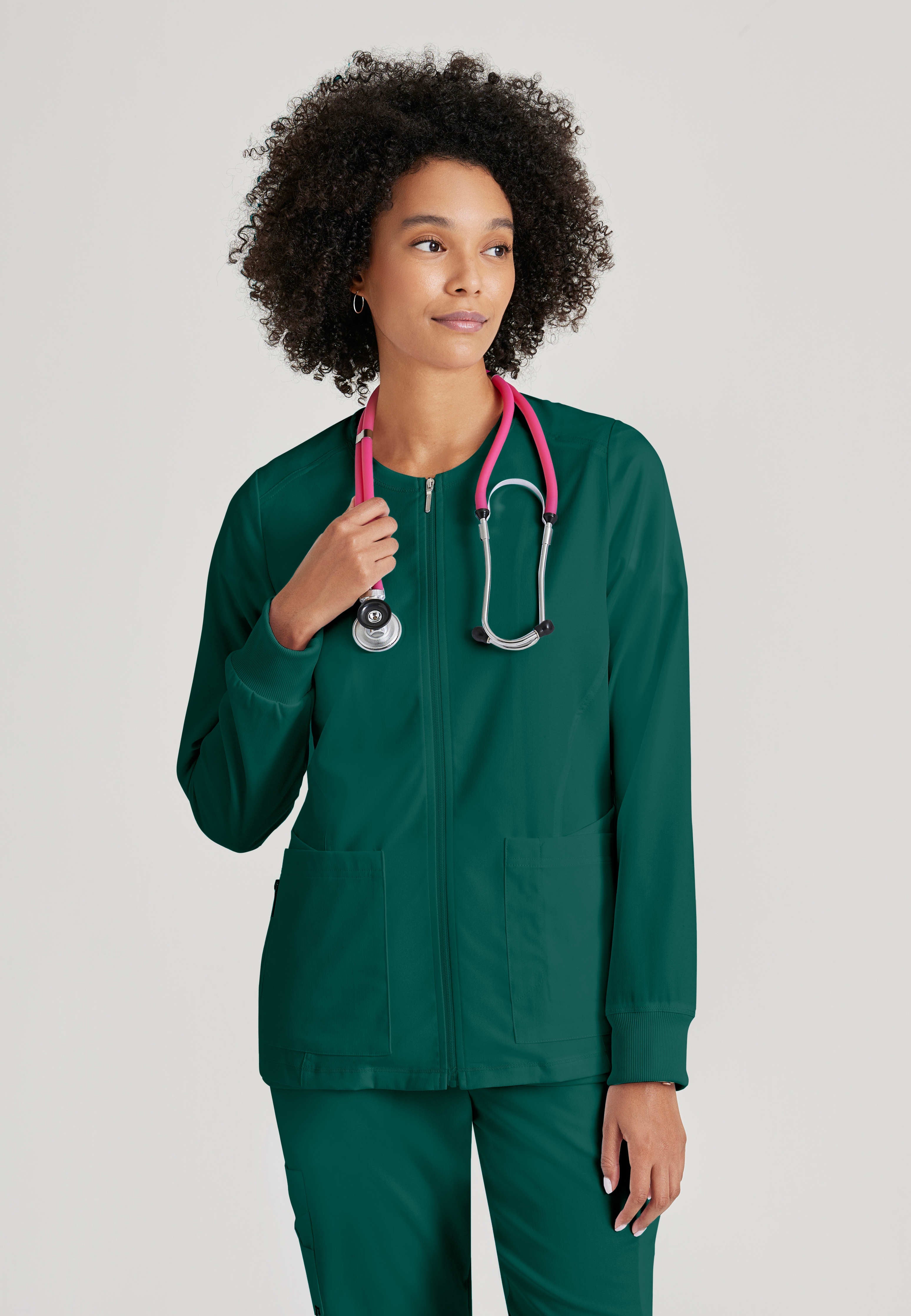 Front View of the Gianna 5-Pocket Crewneck Scrub Jacket in Hunter Green from Grey's Anatomy™ by Barco Spandex Stretch
