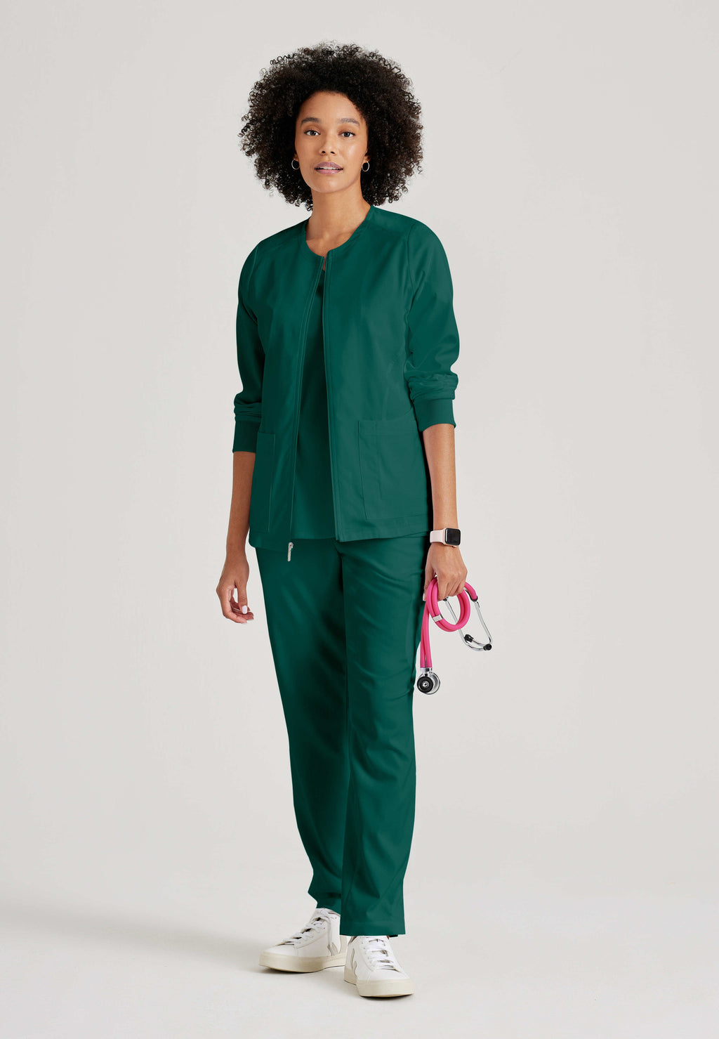Full Body View of the Gianna 5-Pocket Crewneck Scrub Jacket in Hunter Green from Grey's Anatomy™ by Barco Spandex Stretch