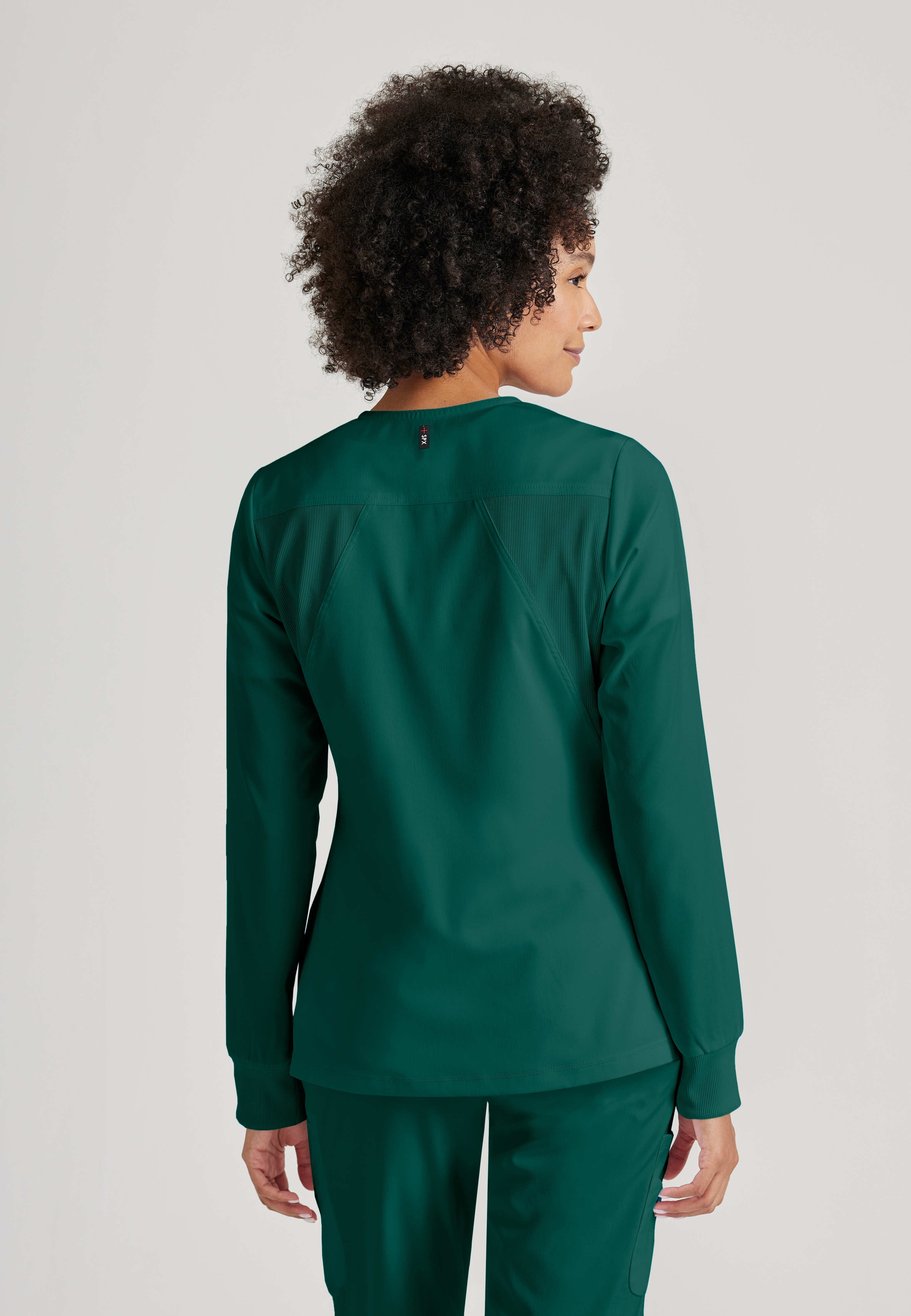 Side View of the Gianna 5-Pocket Crewneck Scrub Jacket in Hunter Green from Grey's Anatomy™ by Barco Spandex Stretch