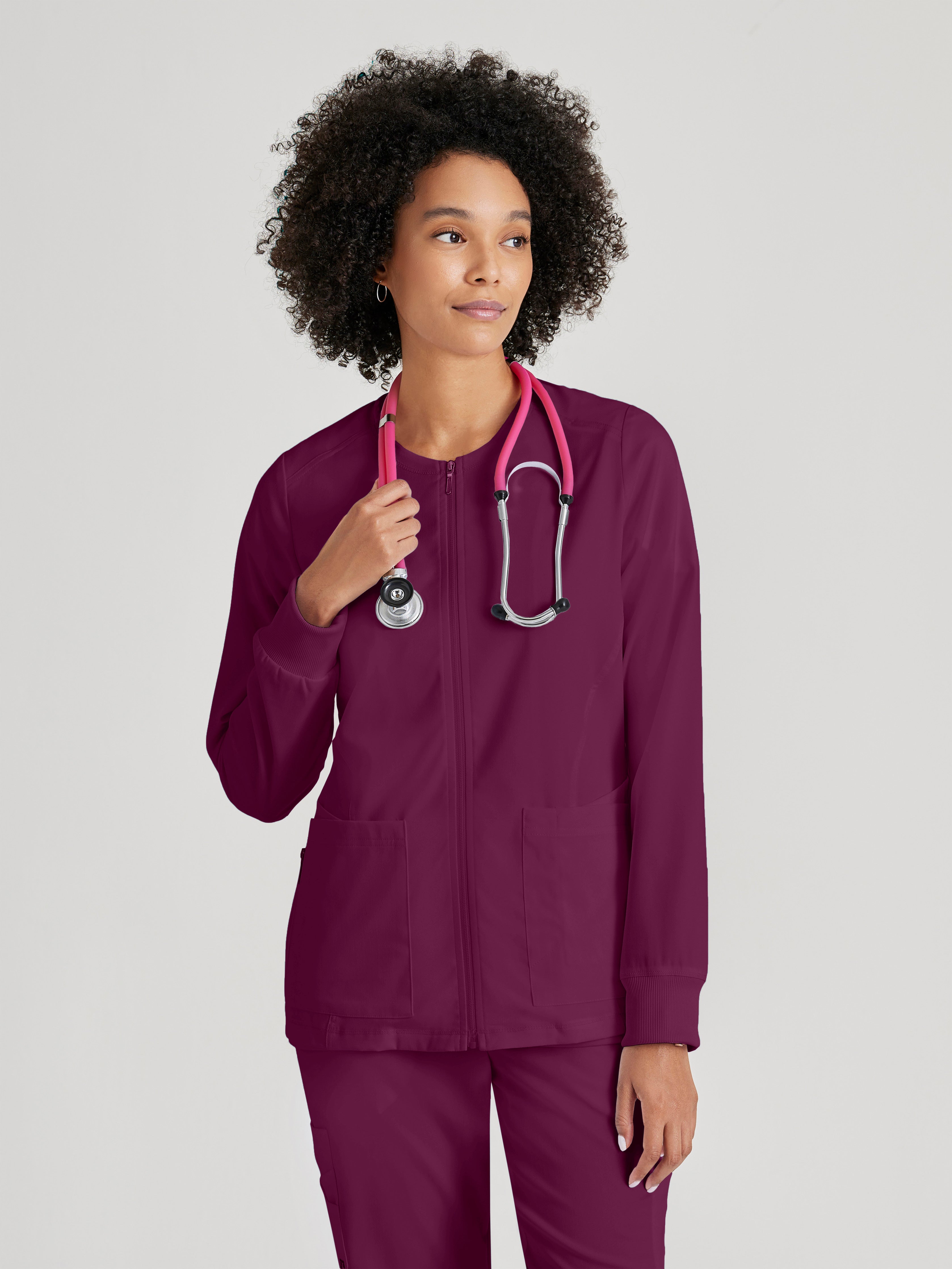 Front View of the Gianna 5-Pocket Crewneck Scrub Jacket in Wine from Grey's Anatomy™ by Barco Spandex Stretch