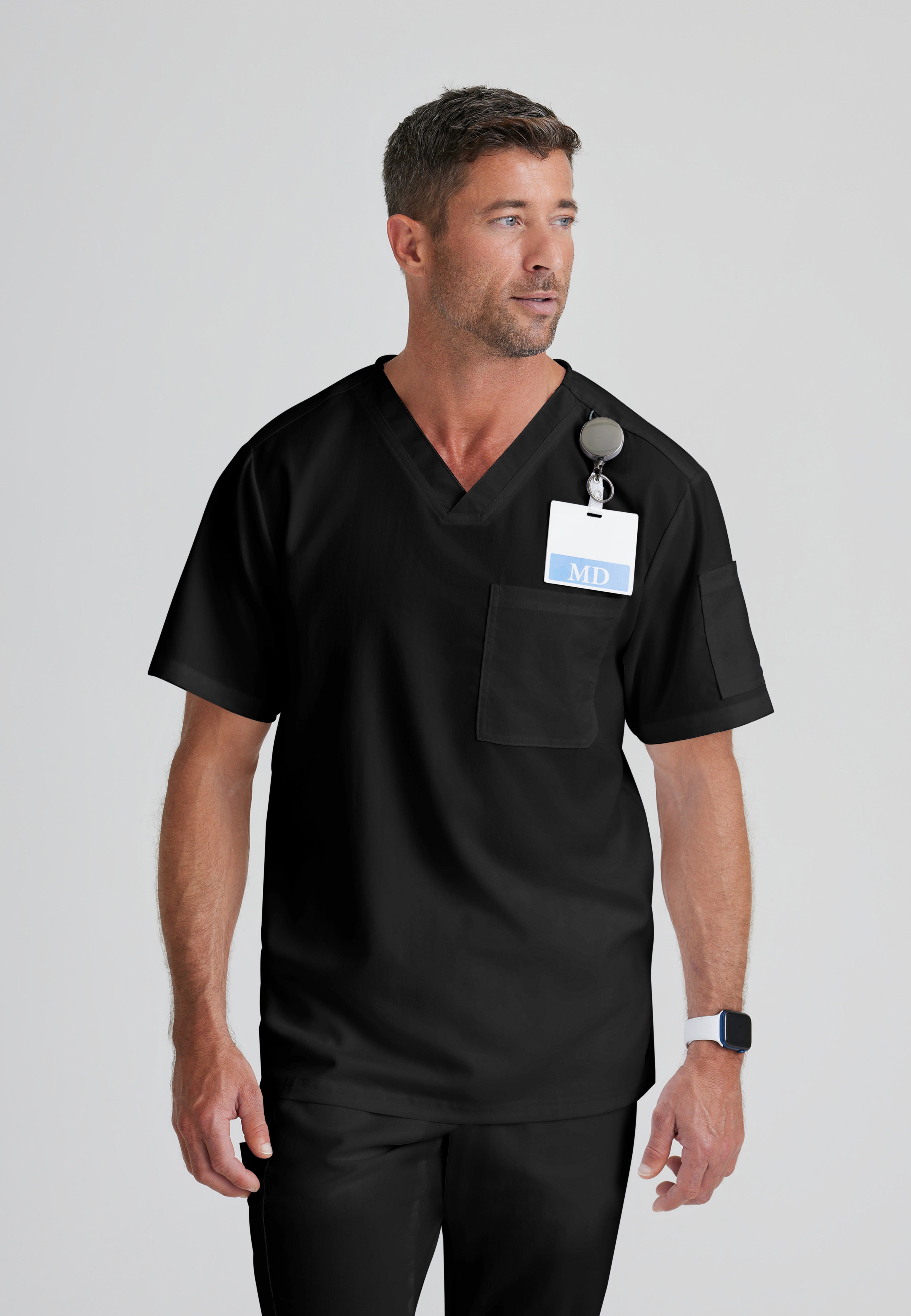 Front View of the Evan 2-Pocket V-Neck Scrub Top in Black from Grey's Anatomy™ by Barco Classic