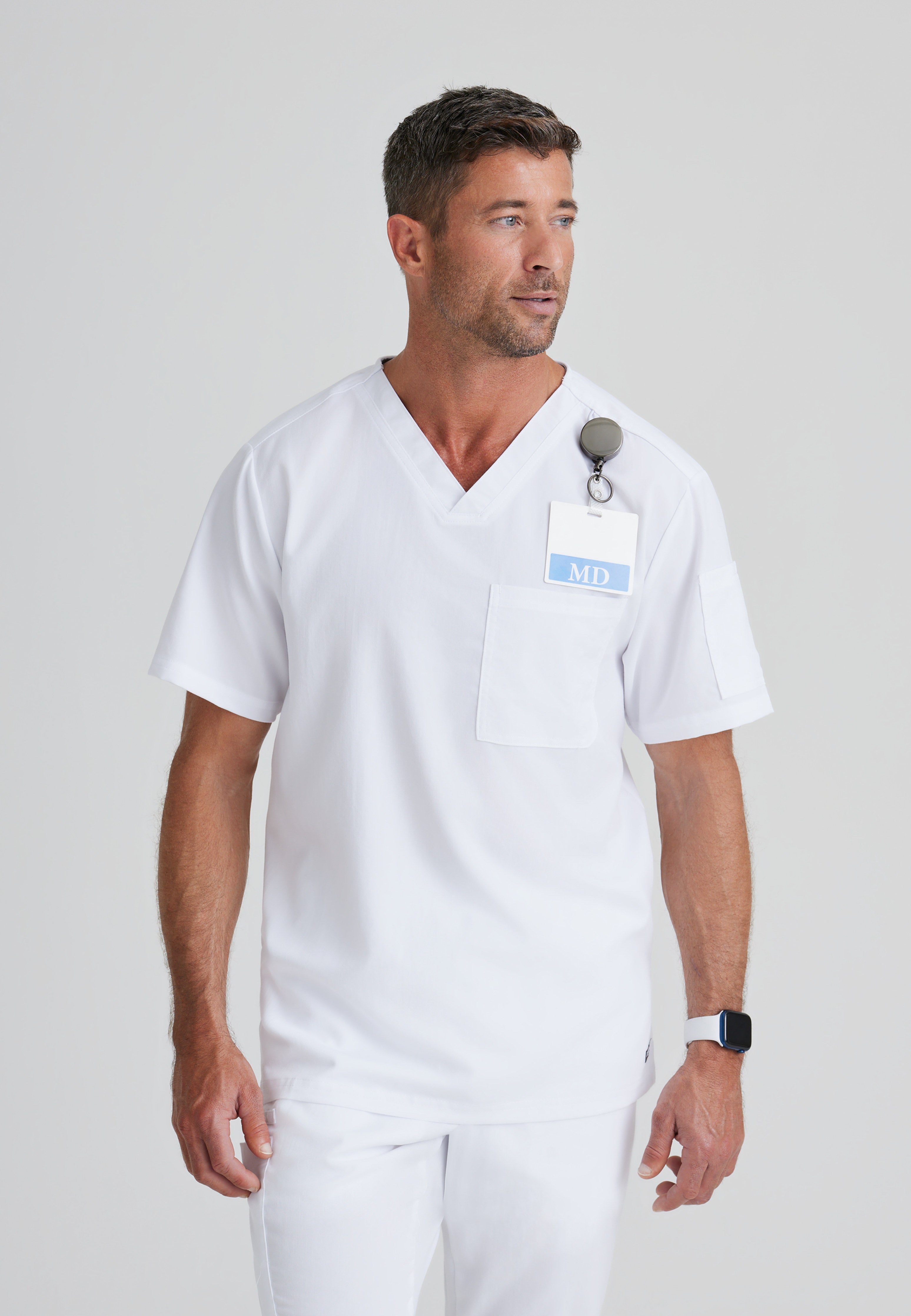 Front View of the Evan 2-Pocket V-Neck Scrub Top in White from Grey's Anatomy™ by Barco Classic